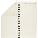 Featuring Desouk Vendace Rug by Jaipur Living at Amethyst Home. The Desouk collection melds modern allure with the global vibes of Morocco. The Vendace hand-knotted rug showcases a geometric linear pattern with contrasting black and cream tones. This handcrafted rug boasts plush, cut wool pile that pairs beautifully with braided tassel details. Perfect for adding warmth to cozy bedrooms an. Amethyst Home provides interior design services, furniture, rugs, and lighting in the Des Moines metro area.