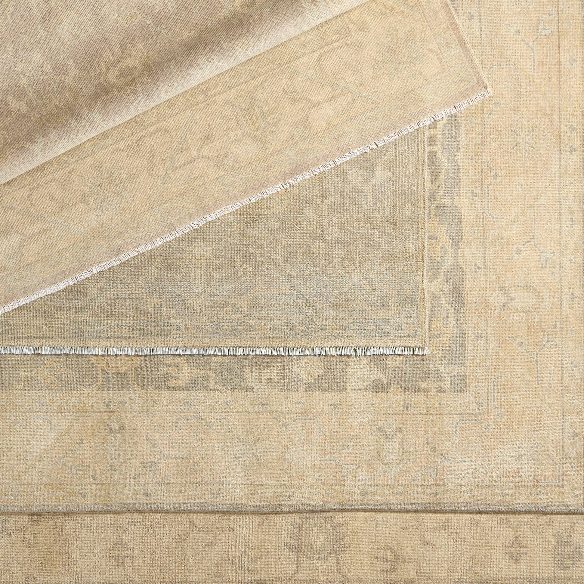 Featuring Eloquent Verity Natural Hand-Knotted Rug by Jaipur Living at Amethyst Home. The Eloquent collection emanates traditional elegance, lending a soft and serene look to transitional homes. The Verity area rug features a faded Oushak design in muted cream, light sage, and gray tones. This hand-knotted wool and viscose rug grounds living spaces with a classic, earthy look. . Amethyst Home provides interior design, new construction, custom furniture, and area rugs in the Los Angeles metro area.