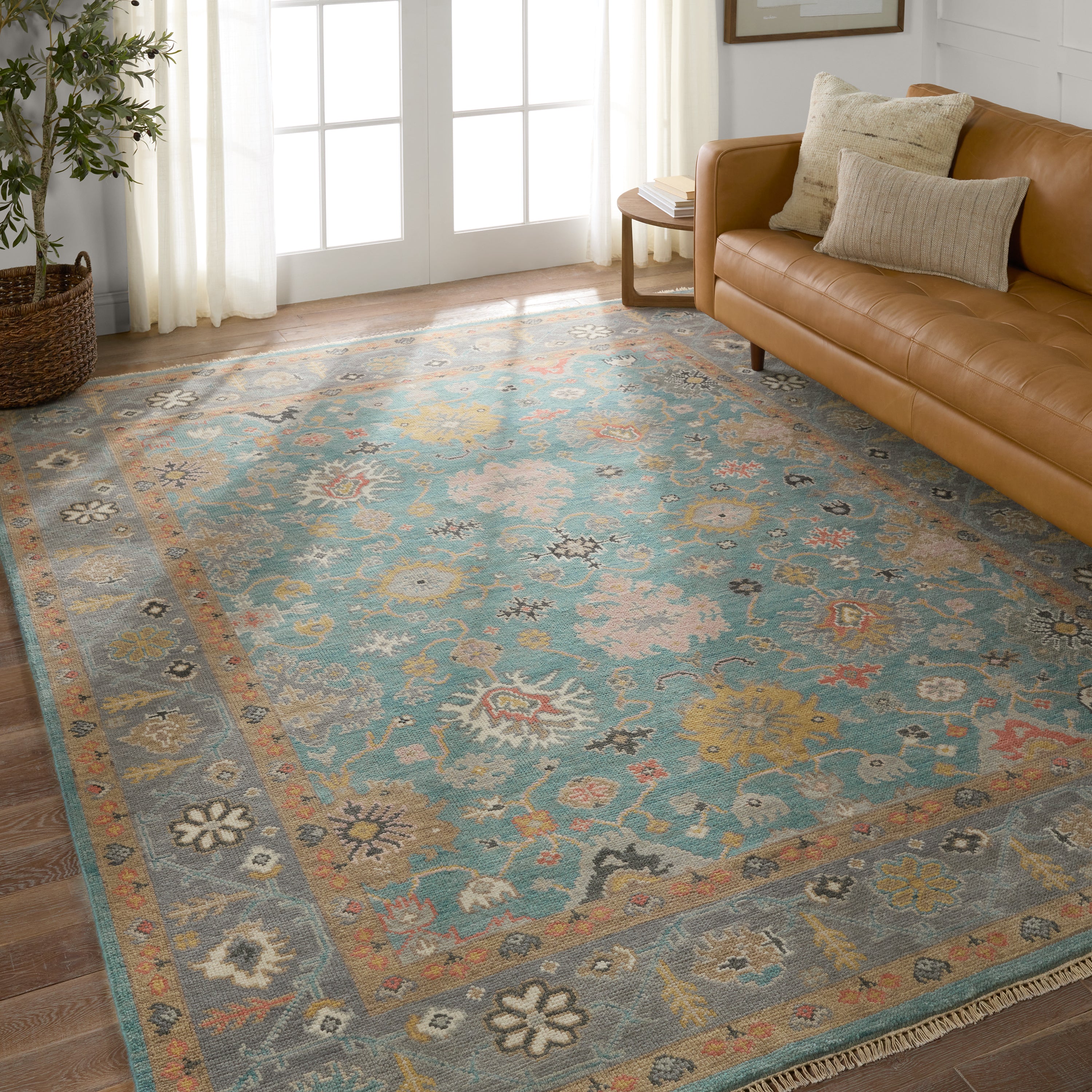 Featuring Everly Aloft Hand-Knotted Rug by Jaipur Living at Amethyst Home. The updated traditional Everly collection features Oushak-inspired designs in whimsical color palettes. The Aloft design features a lively colorway of blue, pink, yellow, navy, cream, peach, and taupe. This hand-knotted wool rug anchors living spaces with a fresh take on vintage style. The low, easy-care . Amethyst Home provides interior design, new construction, custom furniture, and area rugs in the Des Moines metro area.