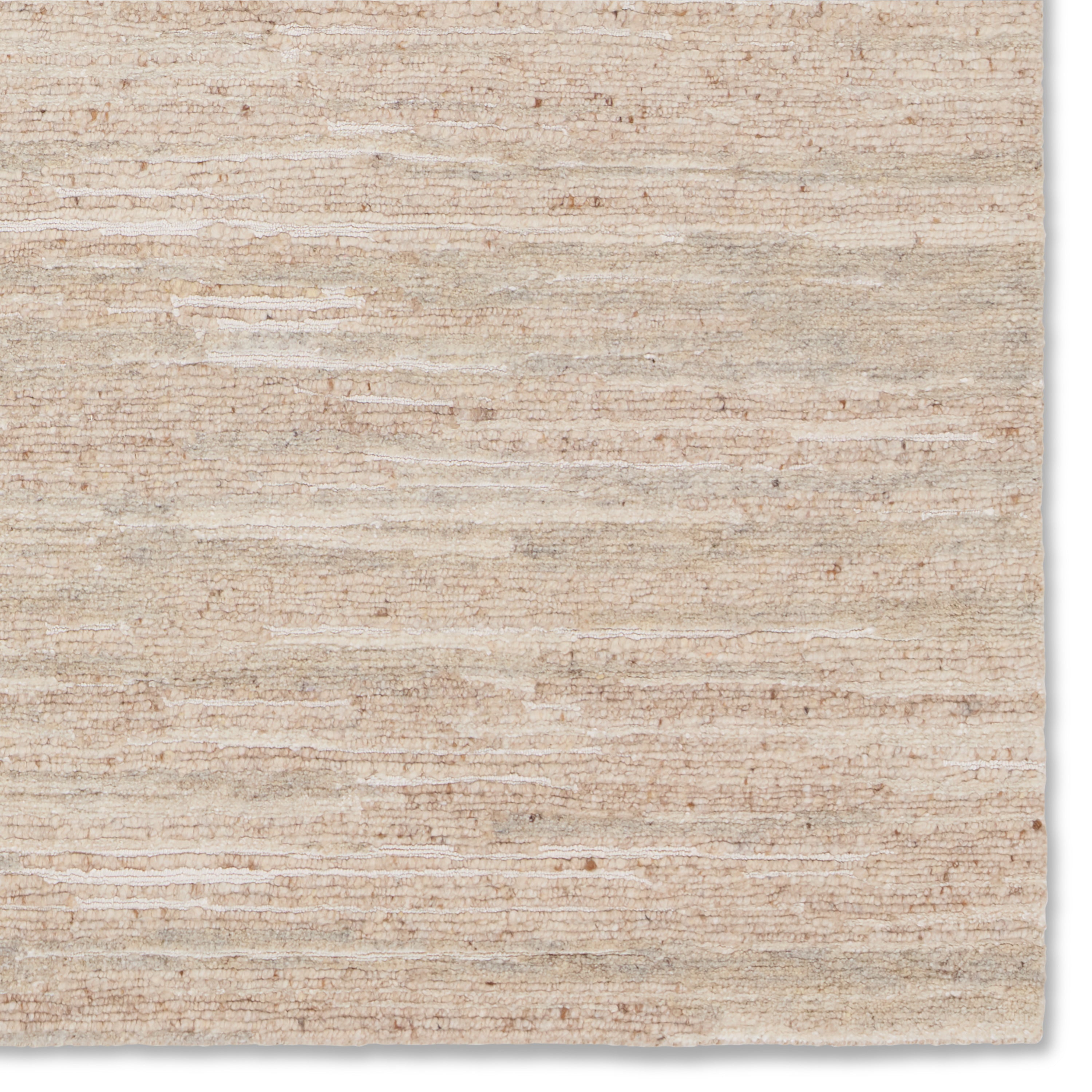 Featuring Farida Jameel Hand-Knotted Rug by Jaipur Living at Amethyst Home. A textural statement with the versatility of the perfect neutral tone, the Farida collection grounds a room with simple sophistication. This handknotted Jameel design features subtle linear details. The undyed wool creates a natural beige background with flecks of brown and black that contrast the cream vis. Amethyst Home provides interior design, new construction, custom furniture, and area rugs in the Houston metro area.