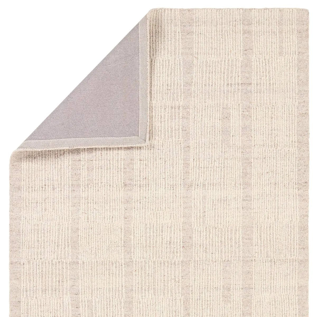 Featuring Finnigan Edher Rug by Jaipur Living at Amethyst Home. Handmade of 100% all-natural, undyed wool, the Edher rug enjoys an understated elegance that is satisfying in its simplicity. Rows of subtle organic stripes play across its field as delicate flecks of brown, accent the instinctive composition. As uncomplicated as it is extraordinary, it exudes a qu. Amethyst Home provides interior design, new home construction design consulting, vintage area rugs, and lighting in the Miami metro area.