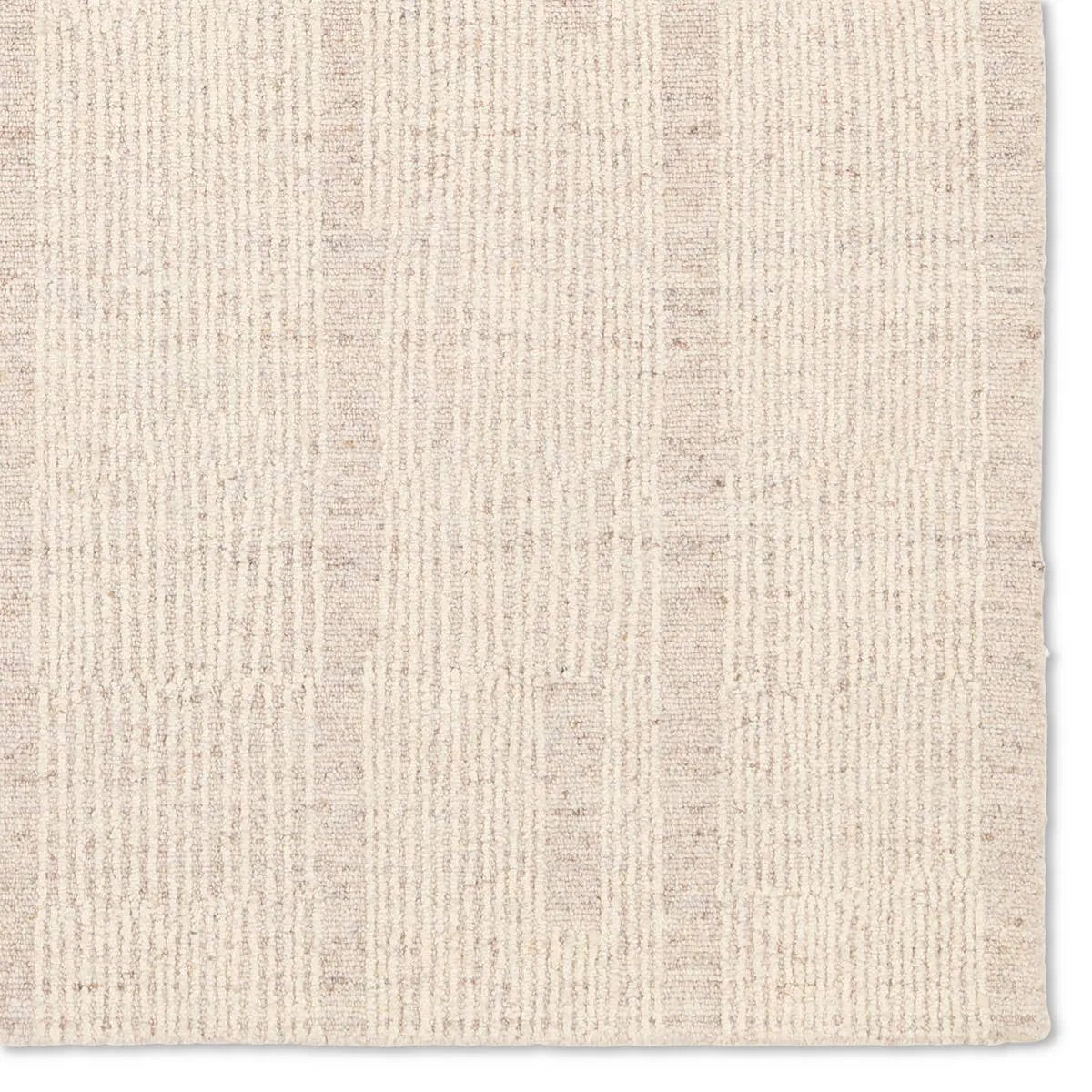Featuring Finnigan Edher Rug by Jaipur Living at Amethyst Home. Handmade of 100% all-natural, undyed wool, the Edher rug enjoys an understated elegance that is satisfying in its simplicity. Rows of subtle organic stripes play across its field as delicate flecks of brown, accent the instinctive composition. As uncomplicated as it is extraordinary, it exu. Amethyst Home provides interior design, new home construction design consulting, vintage area rugs, and lighting in the Winter Garden metro area.