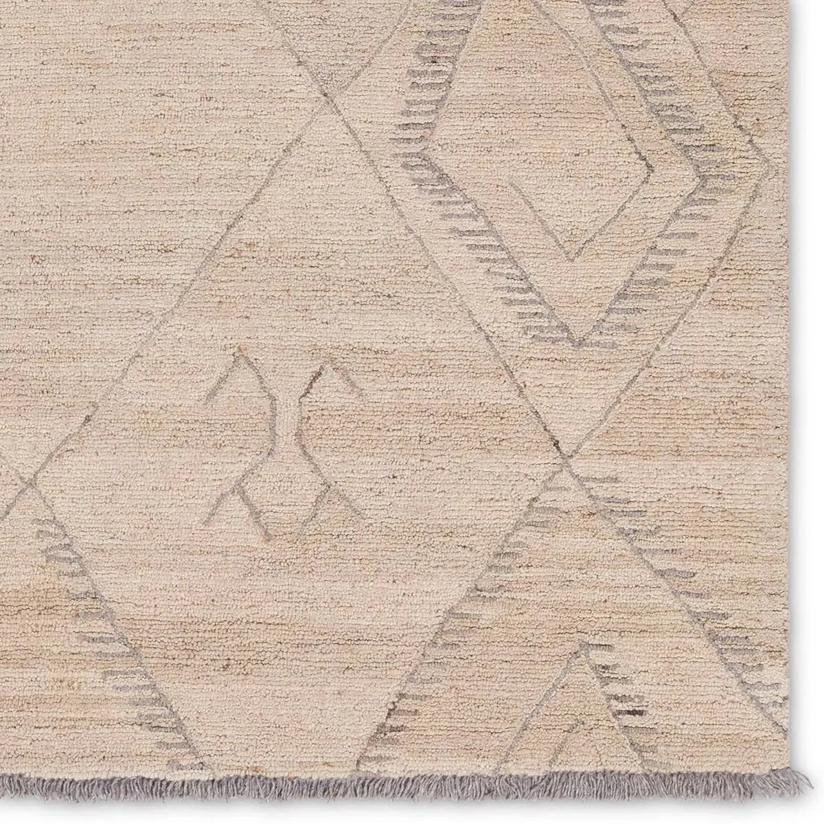 Featuring Hadi Anisah Rug by Jaipur Living at Amethyst Home. The hand-tufted Hadi Anisah introduces fresh looks inspired by modern Moroccan patterns and neutral colorways. The Anisah design features a trellis with geometric detailing, encompassing North African styles in cream and gray hues. Short, gray fringe and 100% wool pile adds to the global appeal. Thi. Amethyst Home provides interior design, new home construction design consulting, vintage area rugs, and lighting in the Seattle metro area.