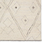 Featuring Hadi Ismael Rug by Jaipur Living at Amethyst Home. The hand-tufted Hadi Ismael introduces fresh looks inspired by modern Moroccan patterns and neutral colorways. The Ismael design features overlapping stripes in cream and gray hues. Short, gray fringe and 100% wool pile adds to the global appeal. This rug is naturally stain-resistant and works best i. Amethyst Home provides interior design, new home construction design consulting, vintage area rugs, and lighting in the Boston metro area.