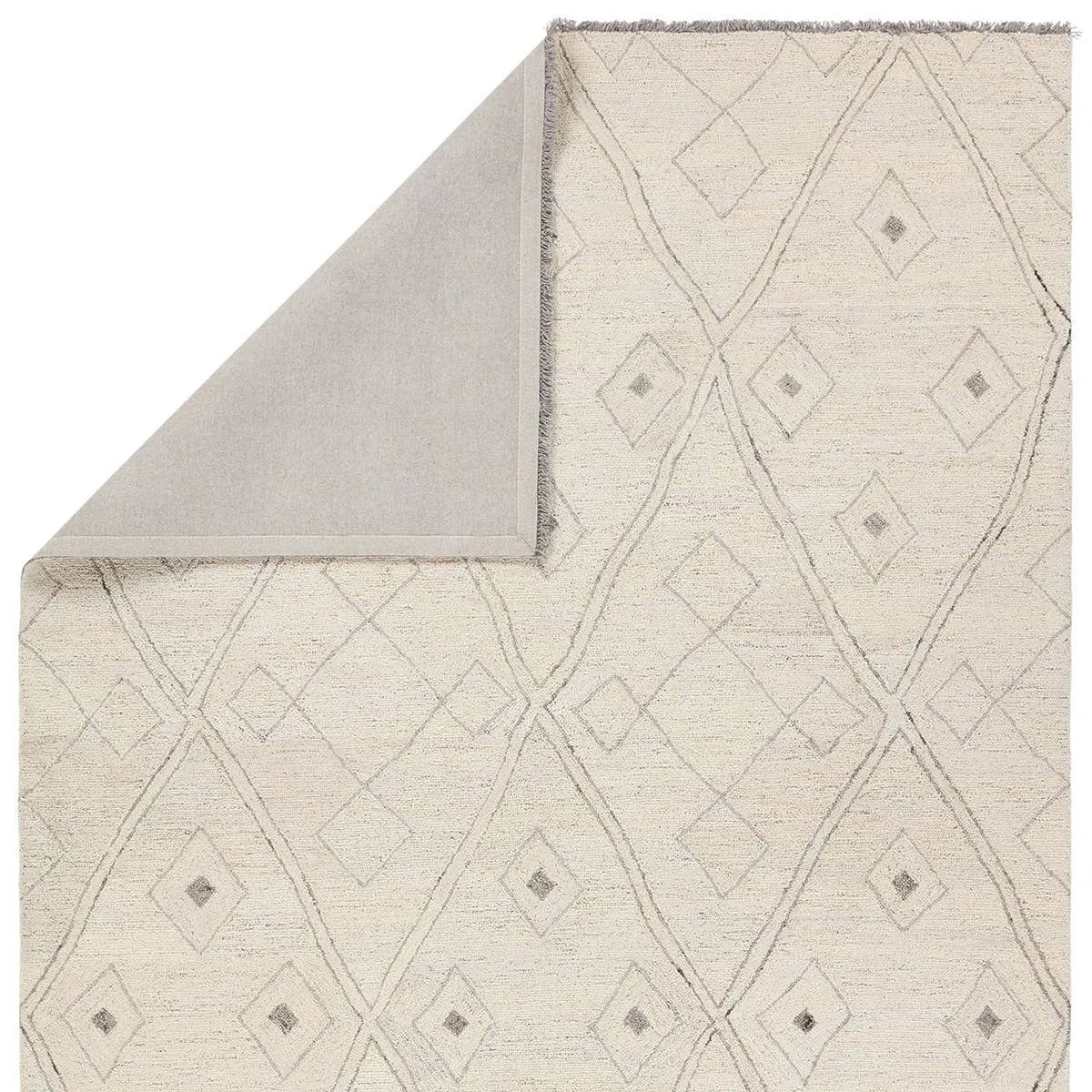 Featuring Hadi Ismael Rug by Jaipur Living at Amethyst Home. The hand-tufted Hadi Ismael introduces fresh looks inspired by modern Moroccan patterns and neutral colorways. The Ismael design features overlapping stripes in cream and gray hues. Short, gray fringe and 100% wool pile adds to the global appeal. This rug is naturally stain-resistant and works b. Amethyst Home provides interior design, new home construction design consulting, vintage area rugs, and lighting in the Kansas City metro area.