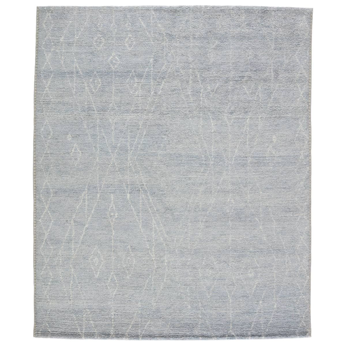 Featuring Indira Ristra Hand-Knotted Rug by Jaipur Living at Amethyst Home. Rich in detail and plush underfoot, the Indira Ristra is made up of neutral-toned modern Moroccan styles. The Ristra area rug features a slight sheen and luxurious hand-knotted construction of natural wool and viscose. A soft trellis design provides geometric interest in an ivo. Amethyst Home provides interior design, new home construction design consulting, vintage area rugs, and lighting in the Salt Lake City metro area.