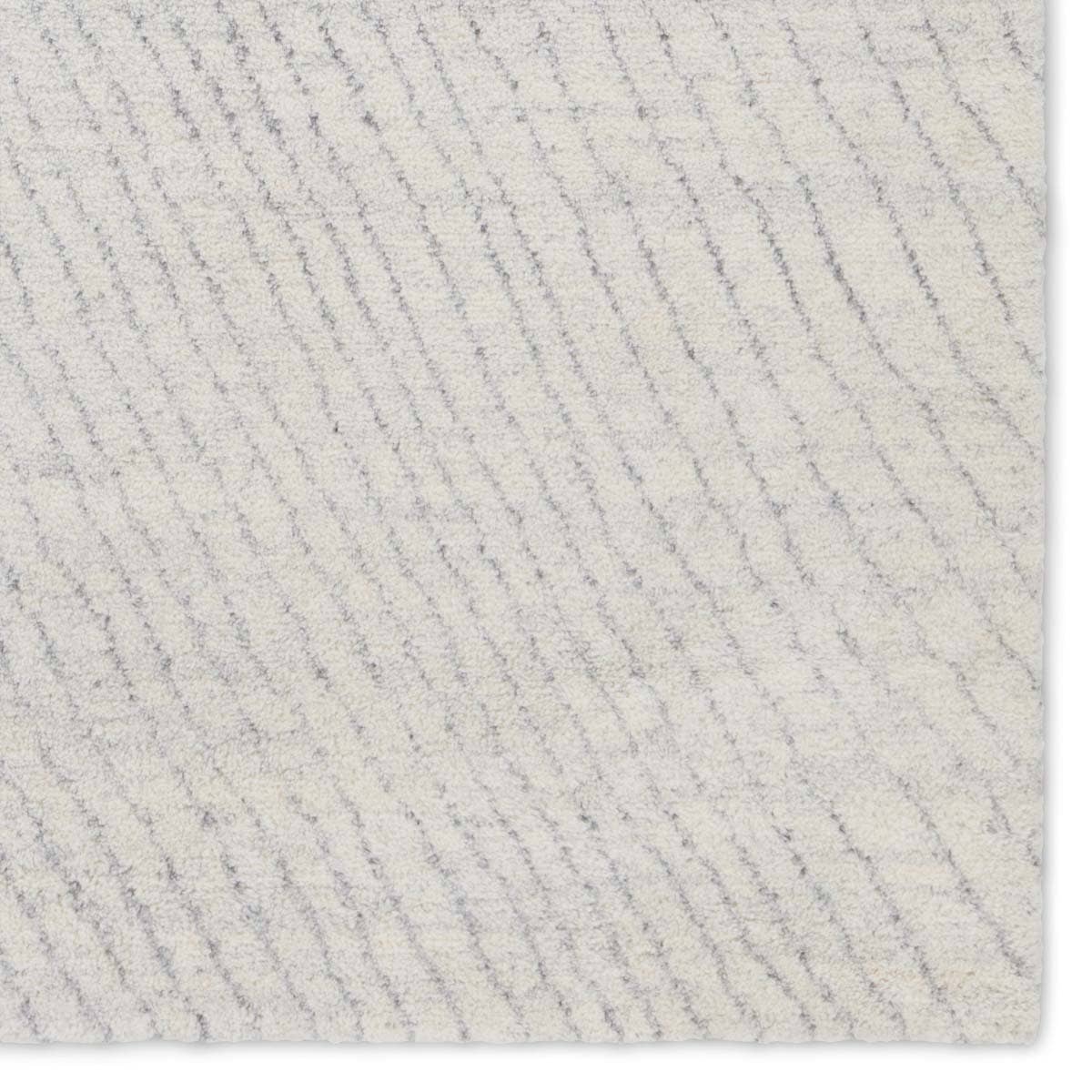 Featuring Indira Zivian Hand-Knotted Rug by Jaipur Living at Amethyst Home. Rich in detail and plush underfoot, the Indira Zivian is made up of neutral-toned modern Moroccan styles. The Zivian area rug features a slight sheen and luxurious hand-knotted construction of natural wool and viscose. A soft linear design provides geometric interest in an light bl. Amethyst Home provides interior design, new home construction design consulting, vintage area rugs, and lighting in the Alpharetta metro area.