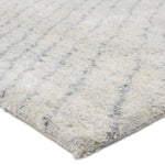 Featuring Indira Zivian Hand-Knotted Rug by Jaipur Living at Amethyst Home. Rich in detail and plush underfoot, the Indira Zivian is made up of neutral-toned modern Moroccan styles. The Zivian area rug features a slight sheen and luxurious hand-knotted construction of natural wool and viscose. A soft linear design provides geometric interest in an light blue h. Amethyst Home provides interior design, new home construction design consulting, vintage area rugs, and lighting in the Dallas metro area.