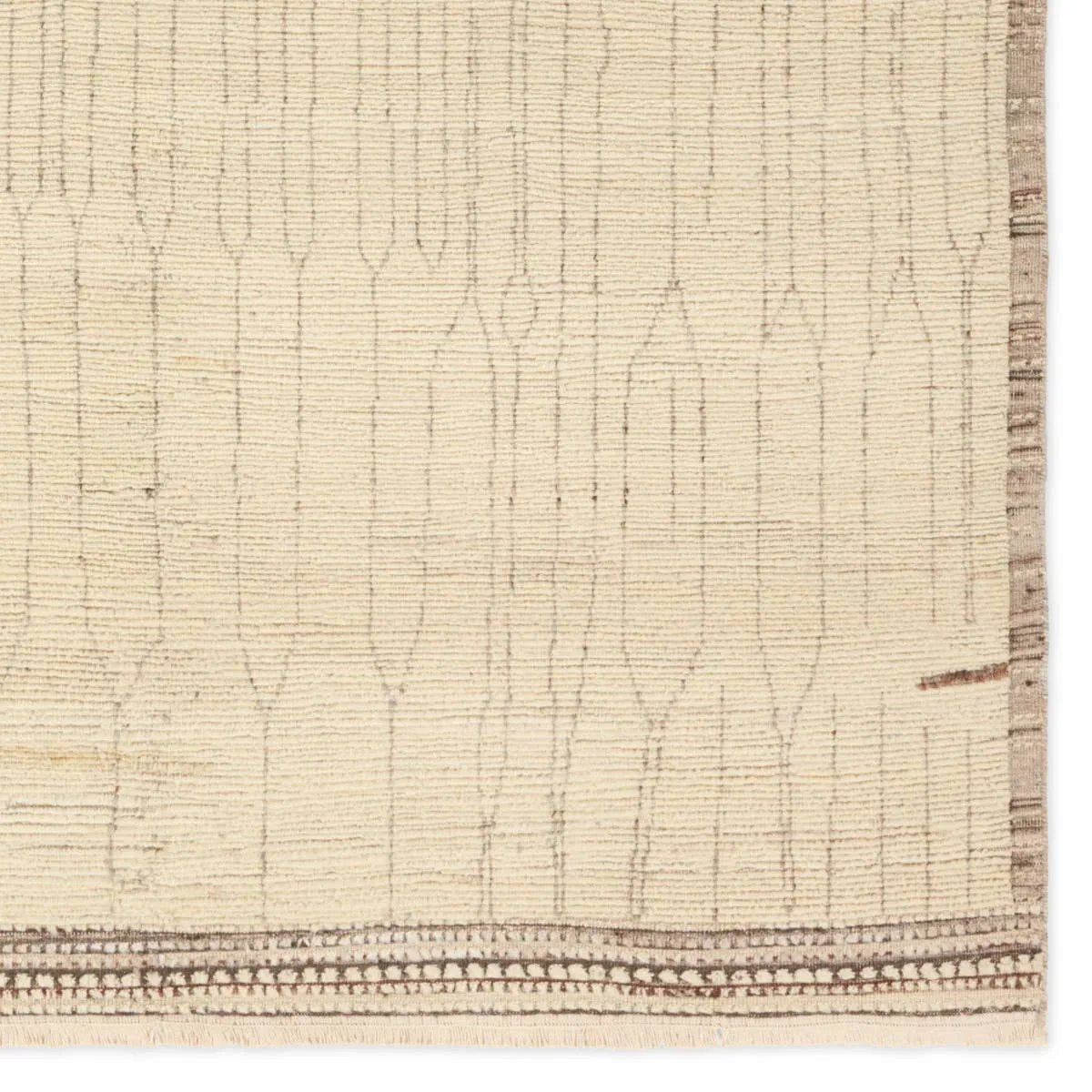 Featuring Kazben Atalaya Hand-Knotted Rug by Jaipur Living at Amethyst Home. Full of texture, the handknotted Kazben Atalaya stuns with modern Moroccan patterns in natural hues. The Atalaya design delights with a gray and brown abstract-linear pattern on a cream base. A dotted border adds the finishing touches to this elevated accent piece. Low, ribbed pile cr. Amethyst Home provides interior design, new home construction design consulting, vintage area rugs, and lighting in the Dallas metro area.