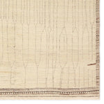 Featuring Kazben Atalaya Hand-Knotted Rug by Jaipur Living at Amethyst Home. Full of texture, the handknotted Kazben Atalaya stuns with modern Moroccan patterns in natural hues. The Atalaya design delights with a gray and brown abstract-linear pattern on a cream base. A dotted border adds the finishing touches to this elevated accent piece. Low, ribbed pile cr. Amethyst Home provides interior design, new home construction design consulting, vintage area rugs, and lighting in the Dallas metro area.