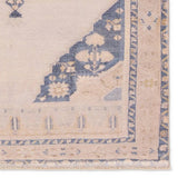 Featuring Lumal Debolo Rug by Jaipur Living at Amethyst Home. Distressed, vintage designs offer an elevated tone for the Lumal Collection. The Debolo rug features a vintage-inspired medallion, geometric border, and floral detailing in tones of tan, blue, yellow, and gray. This machine washable rug is stain resistant and easy to clean, perfect for homes with chi. Amethyst Home provides interior design, new home construction design consulting, vintage area rugs, and lighting in the Omaha metro area.