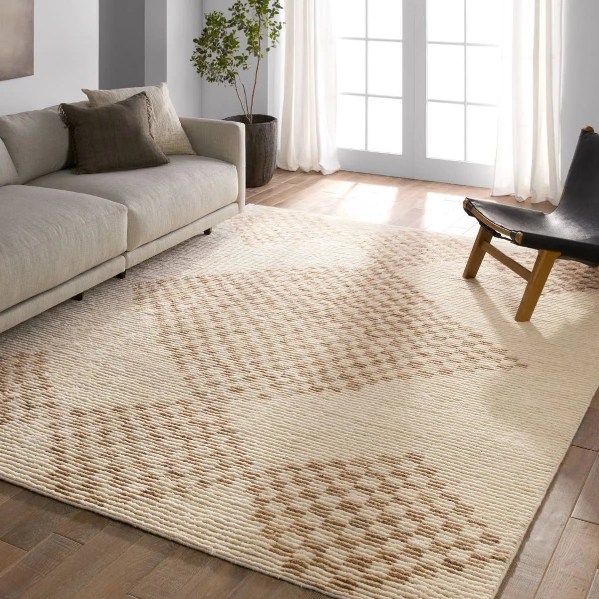 Featuring Merzouga Sarenthia Hand-Knotted Rug by Jaipur Living at Amethyst Home. A stunning array of globally inspired designs in neutral tones define the handknotted Merzouga by Heja Home Sarenthia. The Moroccan-inspired Sarenthia design showcases several checkered diamonds in cream and taupe tones. The 100% wool pile is soft underfoot and inherently stain. Amethyst Home provides interior design, new home construction design consulting, vintage area rugs, and lighting in the Calabasas metro area.