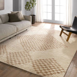 Featuring Merzouga Sarenthia Hand-Knotted Rug by Jaipur Living at Amethyst Home. A stunning array of globally inspired designs in neutral tones define the handknotted Merzouga by Heja Home Sarenthia. The Moroccan-inspired Sarenthia design showcases several checkered diamonds in cream and taupe tones. The 100% wool pile is soft underfoot and inherently stain. Amethyst Home provides interior design, new home construction design consulting, vintage area rugs, and lighting in the Calabasas metro area.