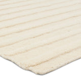 Featuring Modo Brida Rug by Jaipur Living at Amethyst Home. The stunning Modo collection features a statement of modernity in an artisan-crafted quality. This hand-knotted wool rug showcases a compelling textural linear motif and luxurious white colorway. Varied stripes created by cut and loop pile define the Brida area rug. The 100% undyed wool fibers. Amethyst Home provides interior design, new home construction design consulting, vintage area rugs, and lighting in the Salt Lake City metro area.