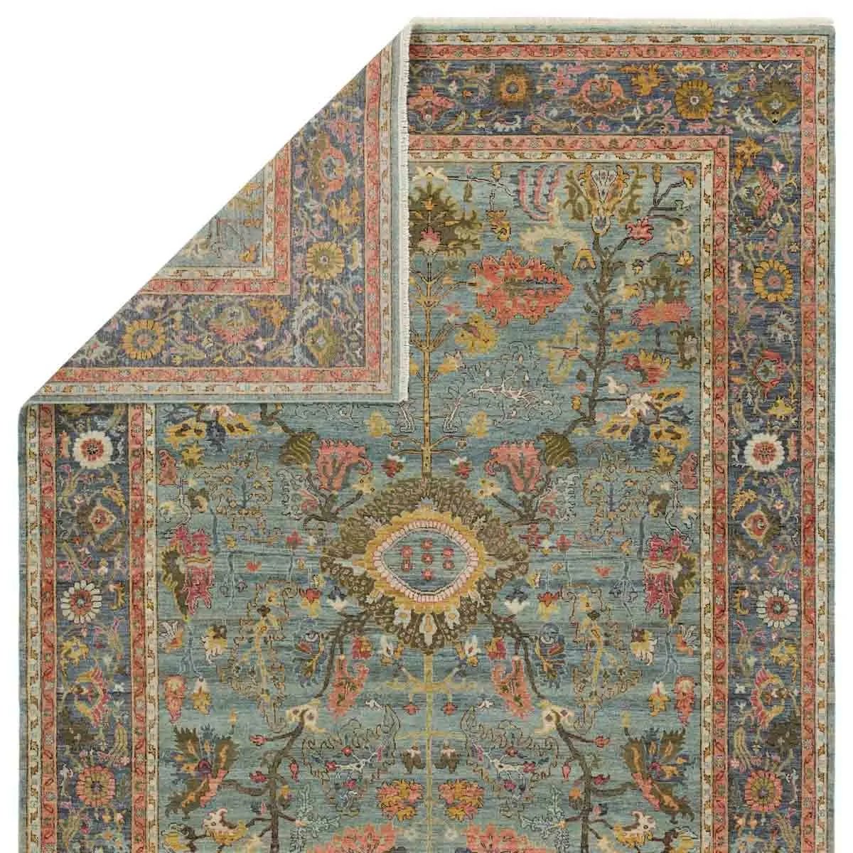 Featuring Novalie Elwood Hand Knotted Rug by Jaipur Living at Amethyst Home. A bold colorway, high knot-count, and intricate designs define the handcrafted Novalie collection. The Elwood design features a medallion with sprawling florals and an intricate border. The blue, pink, green, gold, and gray colors provide visual intrigue and an updated traditional st. Amethyst Home provides interior design, new home construction design consulting, vintage area rugs, and lighting in the Seattle metro area.