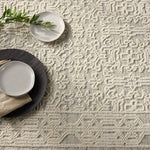 Featuring Reign Ria Rug by Jaipur Living at Amethyst Home. The captivating Reign Ria Rug introduces detail-rich design and inviting high-low pile to contemporary and traditional homes alike. Hand knotted by skilled artisans, the Ria wool rug creates depth and dimension with a cozy inviting cream and light blue palette. Subtle ridges created by the intricate pattern offer soft, tempting texture. Amethyst Home provides interior design services, furniture, rugs, and lighting in the Dallas metro area.