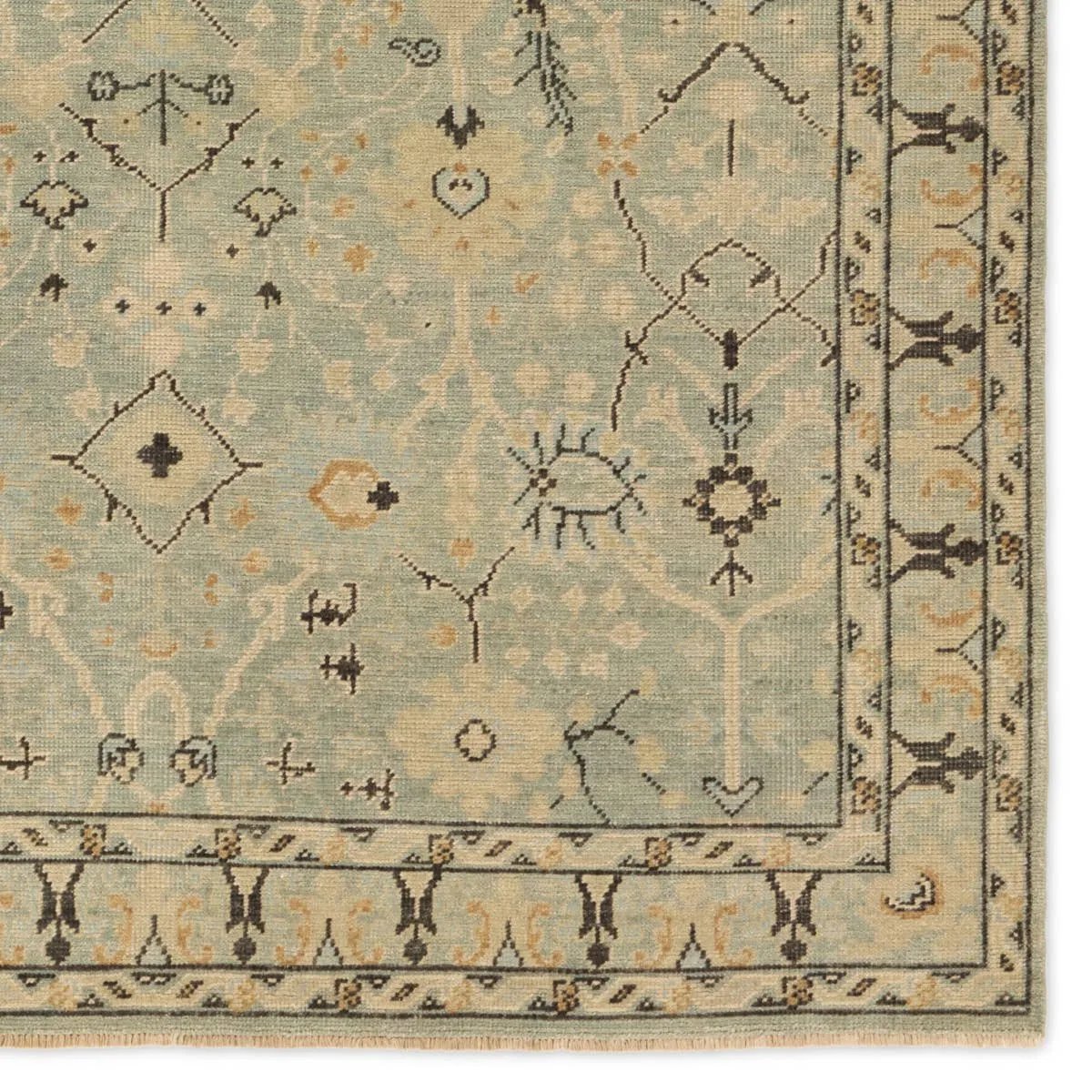 Featuring Rhapsody Markid Hand-Knotted Rug by Jaipur Living at Amethyst Home. The Rhapsody Markid features heirloom-quality designs of stunningly abrashed Old World patterns. The Markid area rug boasts a beautifully distressed floral and Oushak motif with a decorative border. The light blue and tan tones are accented with black and beige hues for added dept. Amethyst Home provides interior design, new home construction design consulting, vintage area rugs, and lighting in the Nashville metro area.
