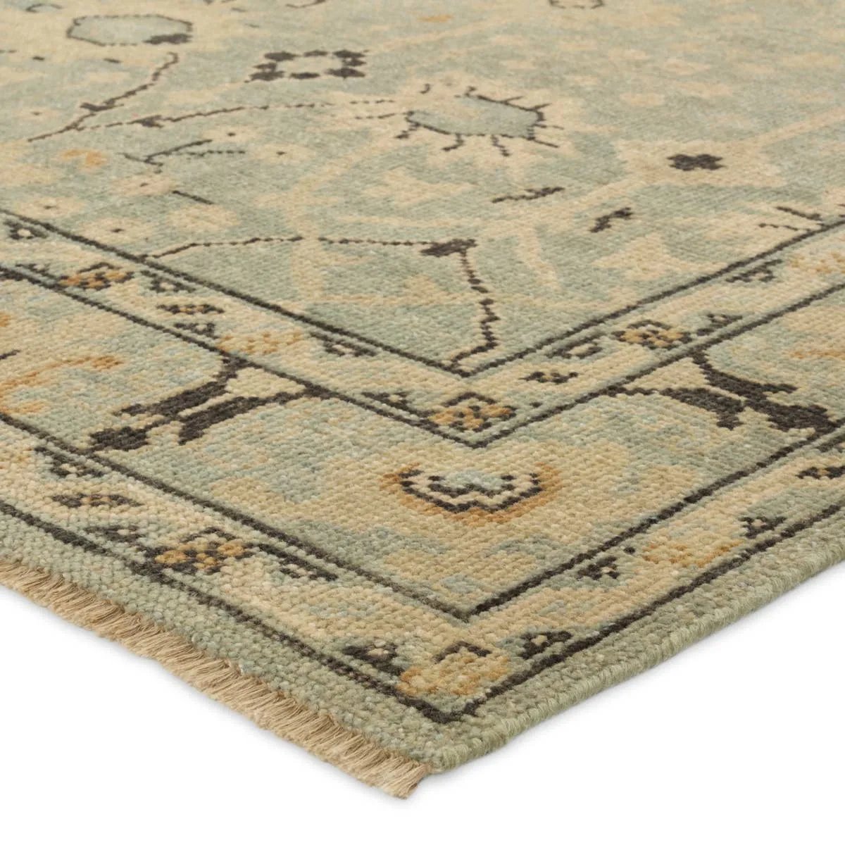 Featuring Rhapsody Markid Hand-Knotted Rug by Jaipur Living at Amethyst Home. The Rhapsody Markid features heirloom-quality designs of stunningly abrashed Old World patterns. The Markid area rug boasts a beautifully distressed floral and Oushak motif with a decorative border. The light blue and tan tones are accented with black and beige hues for added dep. Amethyst Home provides interior design, new home construction design consulting, vintage area rugs, and lighting in the Scottsdale metro area.