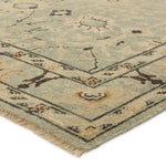 Featuring Rhapsody Markid Hand-Knotted Rug by Jaipur Living at Amethyst Home. The Rhapsody Markid features heirloom-quality designs of stunningly abrashed Old World patterns. The Markid area rug boasts a beautifully distressed floral and Oushak motif with a decorative border. The light blue and tan tones are accented with black and beige hues for added dep. Amethyst Home provides interior design, new home construction design consulting, vintage area rugs, and lighting in the Scottsdale metro area.