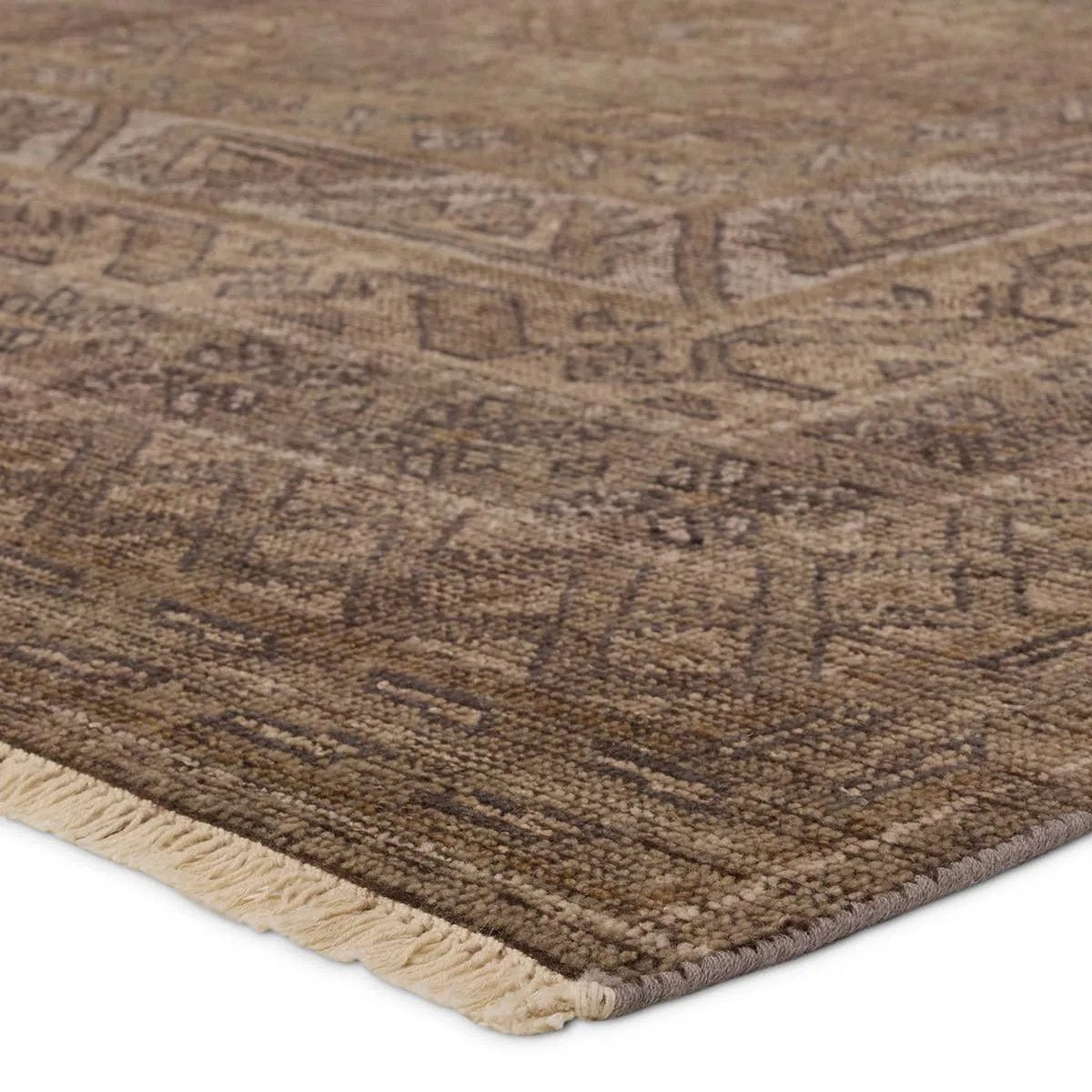 Featuring Rhapsody Kortan Hand-Knotted Rug by Jaipur Living at Amethyst Home. The Rhapsody Kortan features heirloom-quality designs of stunningly abrashed Old World patterns. The Kortan area rug boasts a beautifully distressed mini-medallion motif with a decorative, multi-layered border and geometric detailing. The brown, cream, and tan hues add depth and i. Amethyst Home provides interior design, new home construction design consulting, vintage area rugs, and lighting in the Nashville metro area.