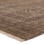 Featuring Rhapsody Kortan Hand-Knotted Rug by Jaipur Living at Amethyst Home. The Rhapsody Kortan features heirloom-quality designs of stunningly abrashed Old World patterns. The Kortan area rug boasts a beautifully distressed mini-medallion motif with a decorative, multi-layered border and geometric detailing. The brown, cream, and tan hues add depth and i. Amethyst Home provides interior design, new home construction design consulting, vintage area rugs, and lighting in the Nashville metro area.