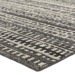 Featuring Rize Jamaal Hand-Knotted Rug by Jaipur Living at Amethyst Home. The Rize collection offers intricate and delicately designed global patterns to the modern home. The luxurious Jamaal area rug showcases a striped, linear motif in a classic gray, cream, and black colorway. This accent's hand-knotted wool construction ensures timeless durability and a stunning presence in bohe. Amethyst Home provides interior design, new construction, custom furniture, and area rugs in the Dallas metro area.