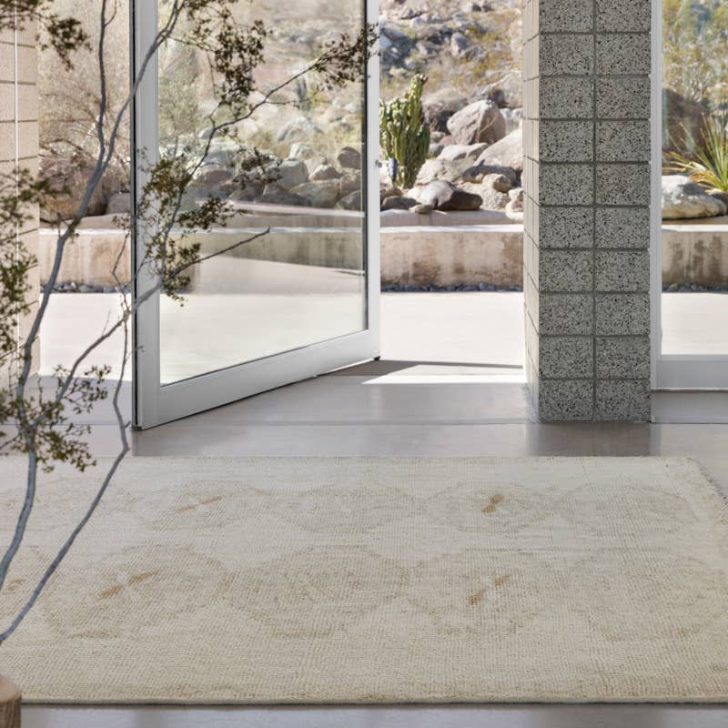 Featuring Sevak Ismail Hand-Knotted Rug by Jaipur Living at Amethyst Home. The hand-knotted Sevak Ismail emulates vintage rugs with traditional Turkish patterns, distressing, and a neutral color palette for versatility. The Ismail design features mini-medallions and a subtle border in tones of tan, cream, and brown. The fringe adds a global charm that delights. Amethyst Home provides interior design, new home construction design consulting, vintage area rugs, and lighting in the Boston metro area.