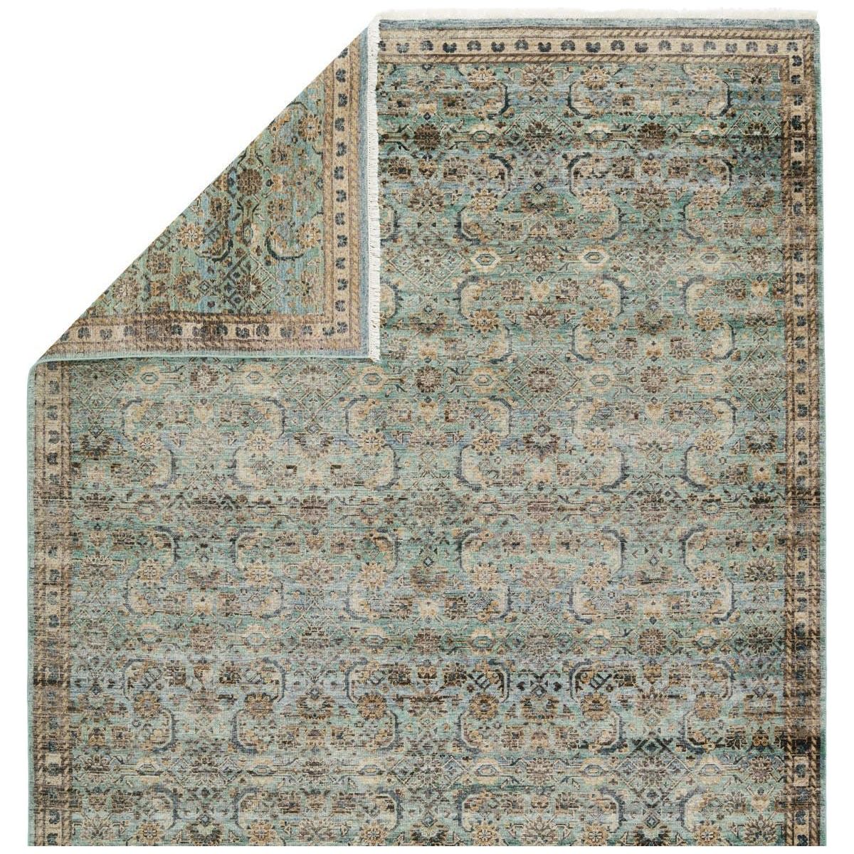 Featuring Someplace In Time Chantay Hand-Knotted Rug by Jaipur Living at Amethyst Home. Whimsical colorways combine with the opulent detail of a traditional-inspired pattern; the Someplace in Time Chantay represents nostalgia and progression, heritage and the contemporary. The Chantay rug's cool blue, green, golden tan, and black details ground spaces w. Amethyst Home provides interior design, new home construction design consulting, vintage area rugs, and lighting in the Newport Beach metro area.
