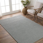 Featuring Strada Shyre Blue Rug by Jaipur Living at Amethyst Home. The Strada Shyre Blue Rug features a unique texture and casual comfort that effortlessly grounds spaces with a solid hue. This handwoven wool rug is crafted from undyed yarn for a distinctive, neutral colorway with natural variation for a bit of dimension. The Shyre rug offers a cozy gray colorway with flecks of brown thro. Amethyst Home provides interior design services, furniture, rugs, and lighting in the Kansas City metro area.