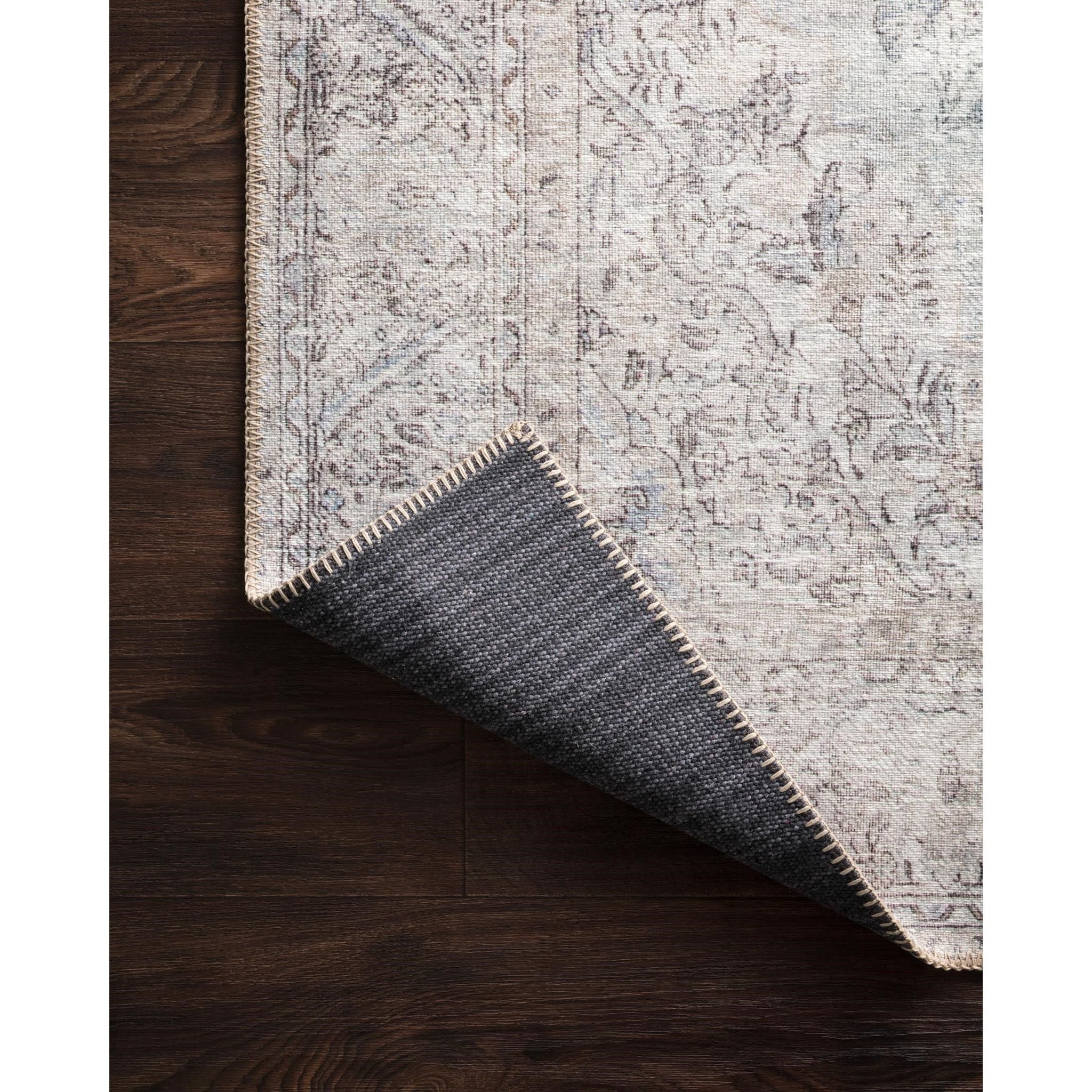 Featuring Loren Silver/Slate Rug by Loloi at Amethyst Home. Timeless and classic, the Loren Collection offers vintage hand-knotted looks at an affordable price. Created in Turkey using the most advanced rug-making technology, these printed designs provide a textured effect by portraying every single individual knot on a soft polyester base.
Power Loomed.  Amethyst Home provides interior design, new home construction design consulting, vintage area rugs, and lighting in the Laguna Beach metro area.