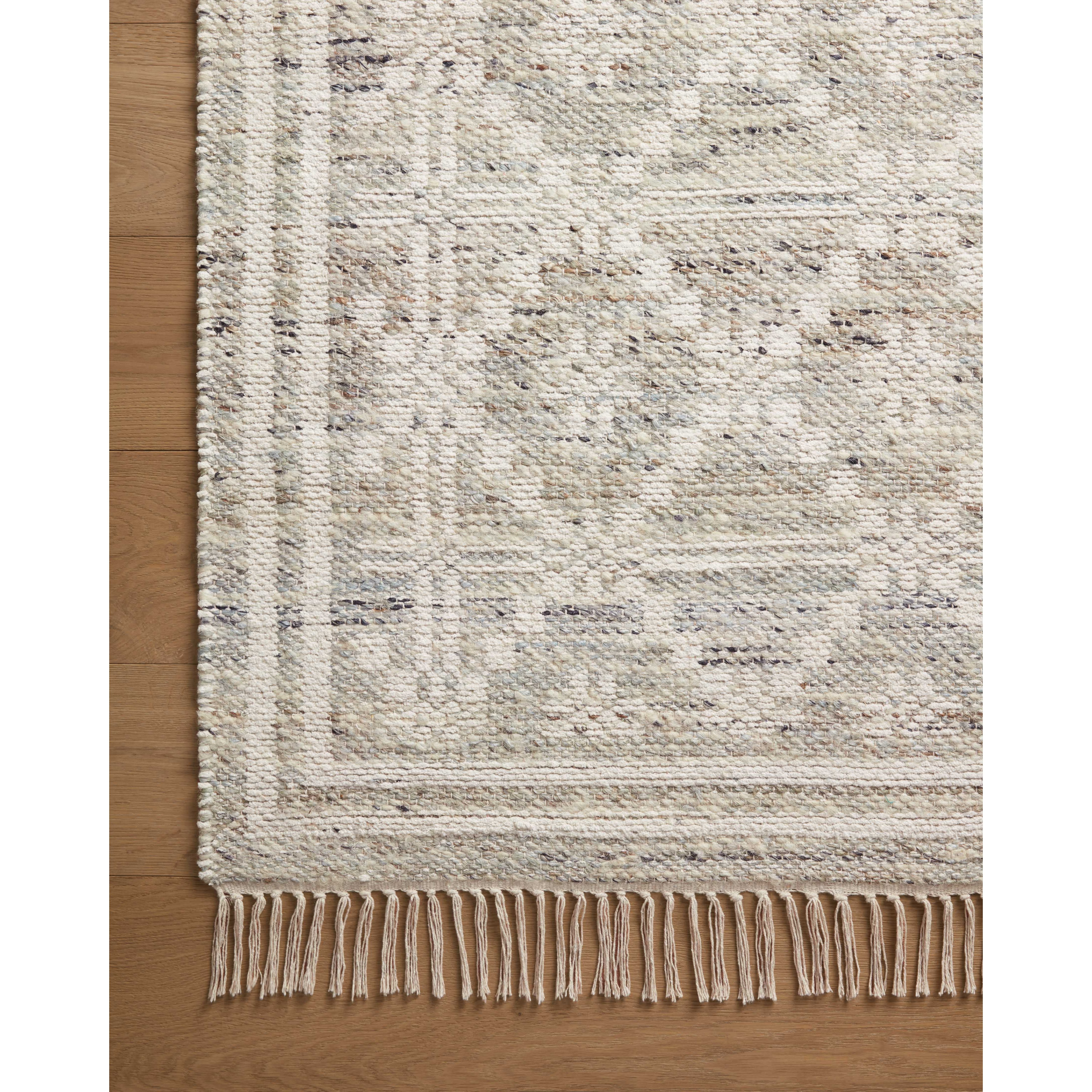 Featuring Angela Rose x Loloi Rivers Lagoon / Ivory Rug by Loloi at Amethyst Home. The Rivers Lagoon / Ivory rug by Angela Rose x Loloi is a modern flatweave area rug with a reversible design featuring symmetrical motifs. Woven of wool, cotton, and jute, Rivers combines natural materials with an airy, natural aesthetic. The soft colors of the rug create a wate. Amethyst Home provides interior design, new home construction design consulting, vintage area rugs, and lighting in the Boston metro area.
