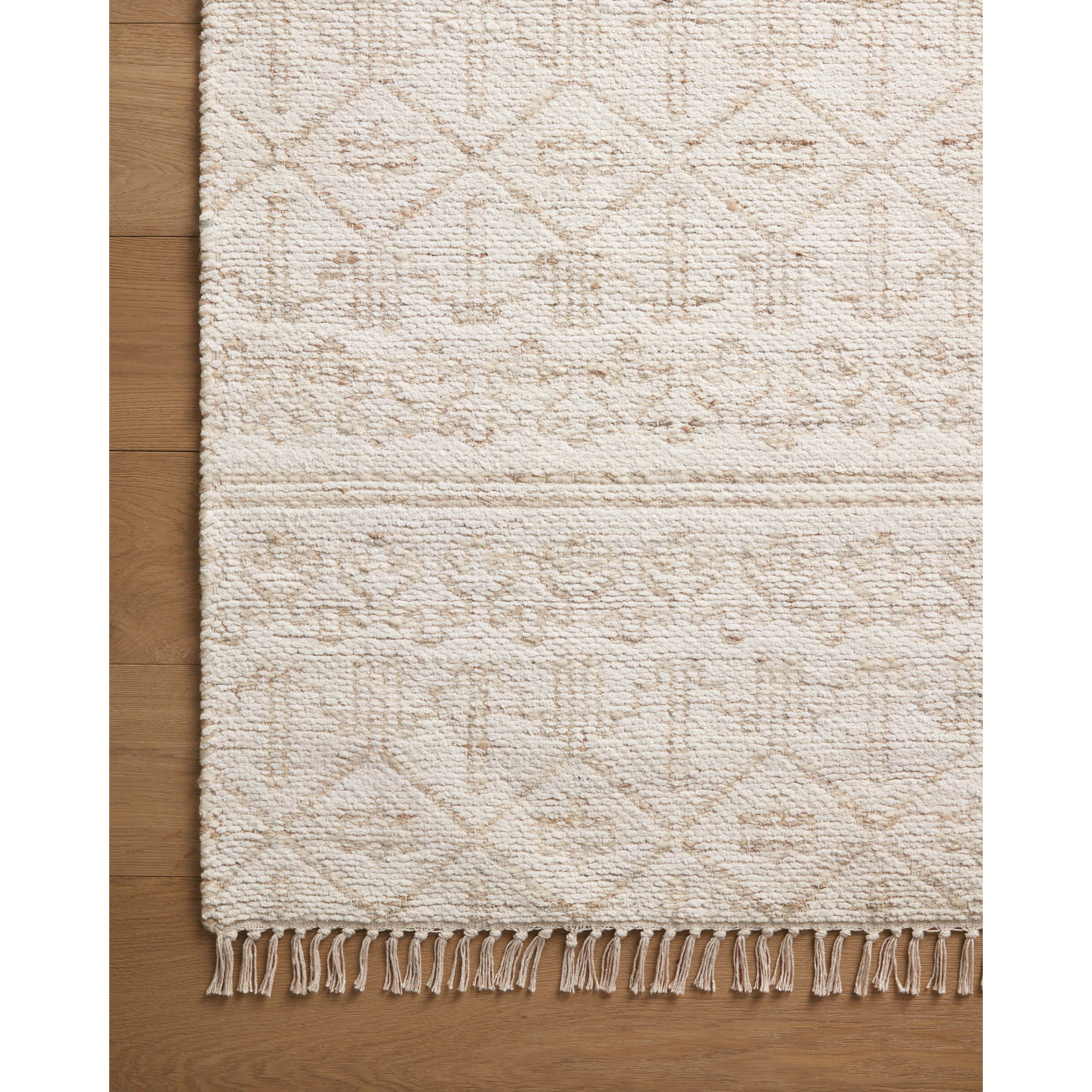 Featuring Angela Rose x Loloi Rivers Sand / Ivory Rug by Loloi at Amethyst Home. The Rivers Sand / Ivory rug by Angela Rose x Loloi is a modern flatweave area rug with a reversible design featuring symmetrical motifs. Woven of wool, cotton, and jute, Rivers combines natural materials with an airy, natural aesthetic. The soft colors of the rug create a watercolo. Amethyst Home provides interior design, new home construction design consulting, vintage area rugs, and lighting in the Omaha metro area.