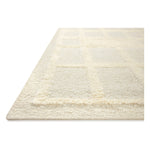 Featuring Cassian Ivory Rug by Loloi at Amethyst Home. The Cassian Ivory Rug is a hand-woven wool and cotton area rug with an asymmetrical gridded pattern and high-low texture. The rug’s higher, shaggy pile takes cues from Moroccan designs, while the neutral colors and natural materials make it a cozy addition to any space, especially living rooms and dens.. Amethyst Home provides interior design, new home construction design consulting, vintage area rugs, and lighting in the Baltimore metro area.