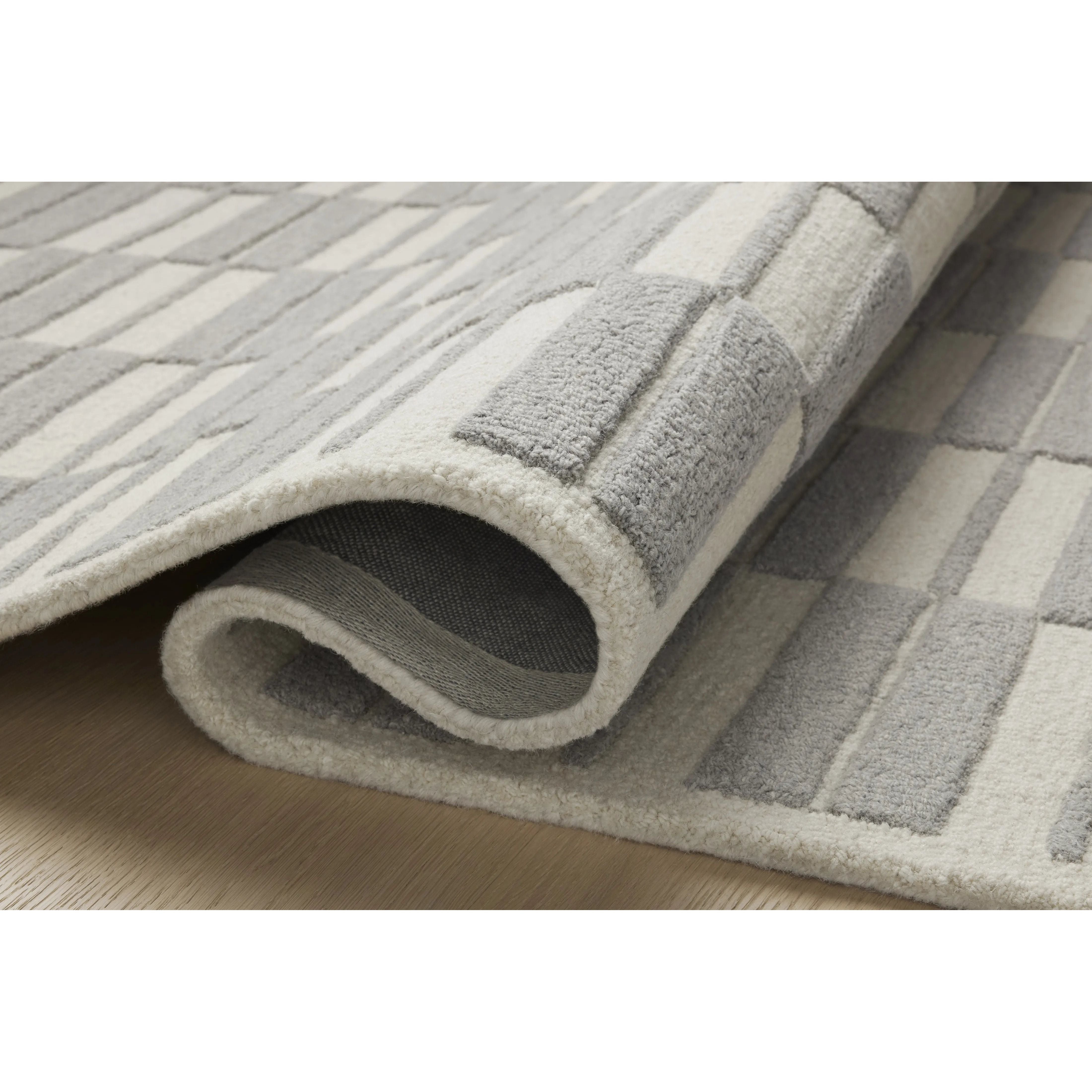 Featuring Chris Loves Julia x Loloi Bradley Ivory / Grey Rug by Loloi at Amethyst Home. The Bradley Collection from Chris Loves Julia x Loloi takes the classic striped rug to new heights. This hand-tufted, 100% wool collection features two-toned linear patterns with alternating high-low pile. Bradley is GoodWeave-certified, ensuring our commitment to ethical pr. Amethyst Home provides interior design, new home construction design consulting, vintage area rugs, and lighting in the Tampa metro area.