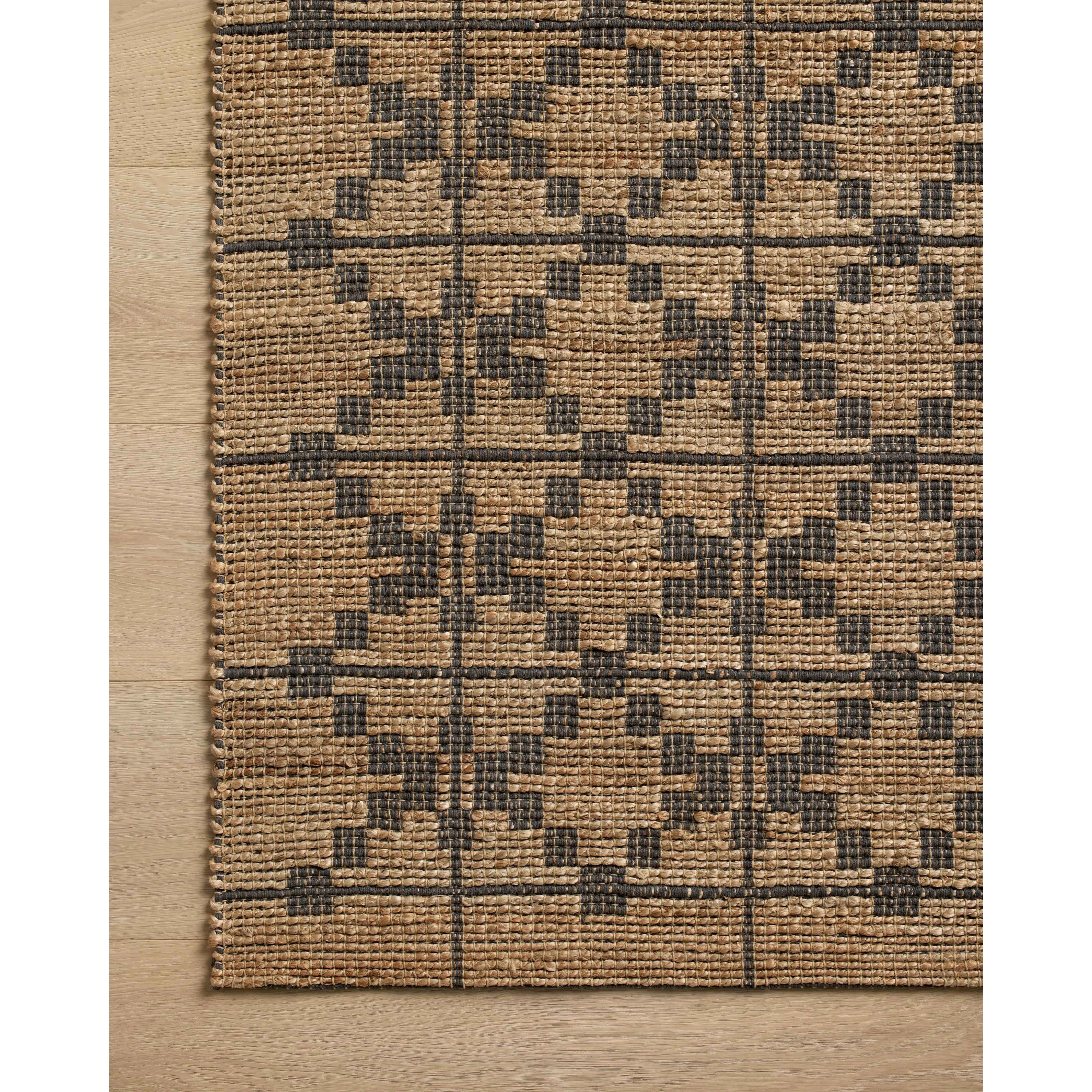 Featuring Chris Loves Julia x Loloi Judy Natural / Graphite Rug by Loloi at Amethyst Home. Hand Woven76% Jute l 24% CottonJUD-05 Natural / GraphitePile Height: 0.5". Amethyst Home provides interior design, new home construction design consulting, vintage area rugs, and lighting in the Dallas metro area.