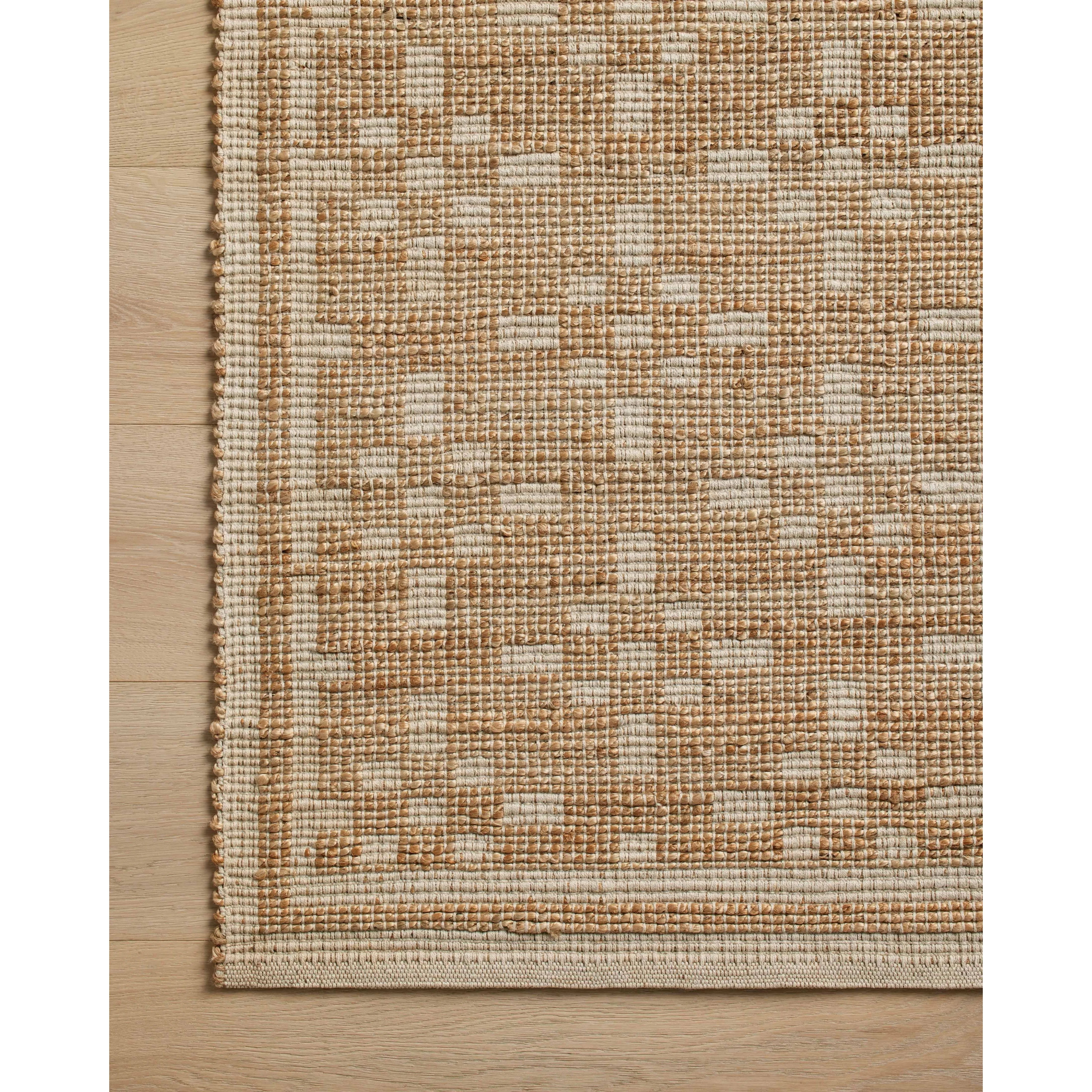 Featuring Chris Loves Julia x Loloi Judy Natural / Ivory Rug by Loloi at Amethyst Home. Soft texture meets fresh appeal in this signature rug collaboration from Chris Loves Julia and Loloi. This rug is handmade with a striking geometric pattern that grounds its minimalist motifs in natural tones. The jute-forward blend offers a supple yet sturdy tread for e. Amethyst Home provides interior design, new home construction design consulting, vintage area rugs, and lighting in the Nashville metro area.