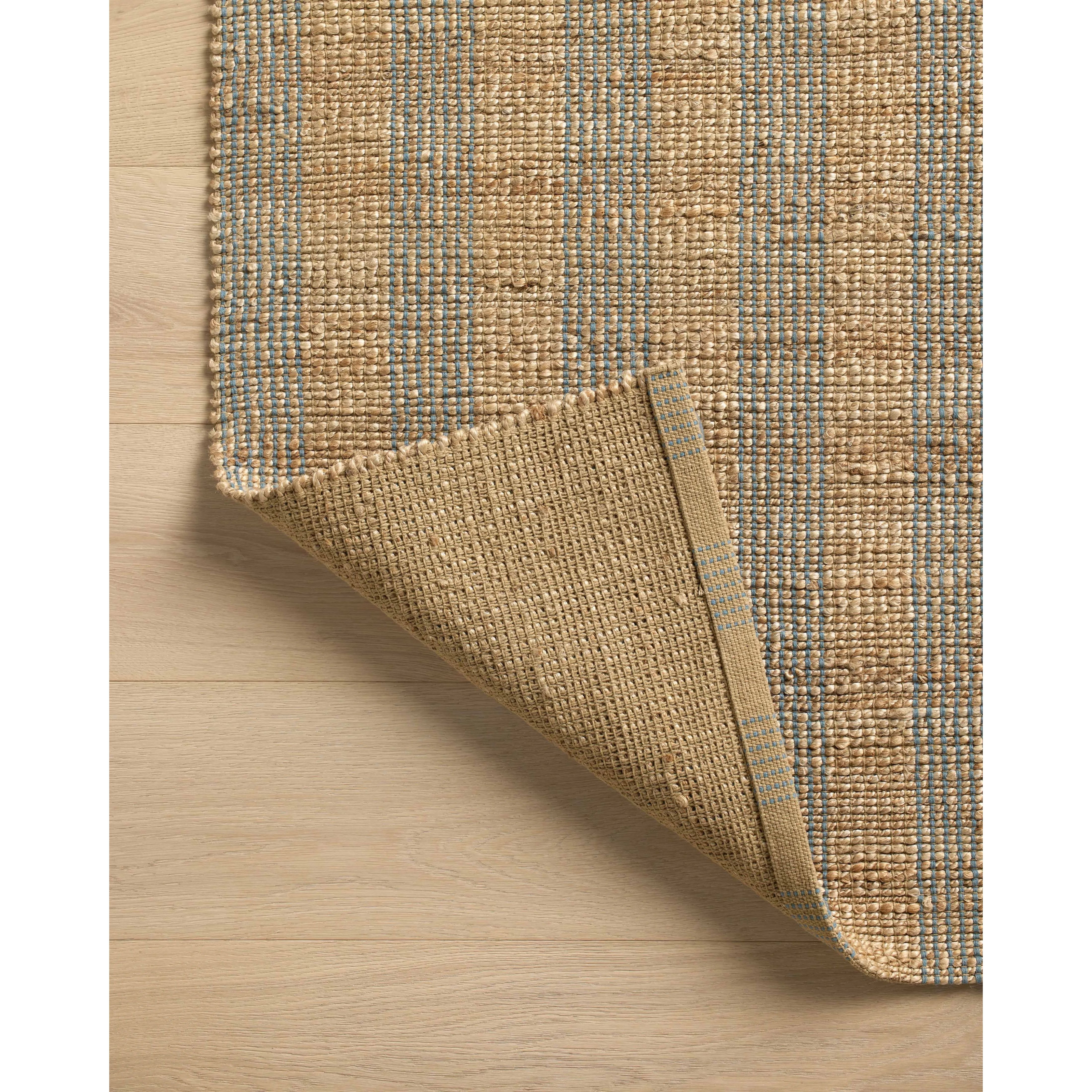 Featuring Chris Loves Julia x Loloi Judy Natural / Sky Rug by Loloi at Amethyst Home. Hand Woven76% Jute l 24% CottonJUD-04 Natural / SkyPile Height: 0.5". Amethyst Home provides interior design, new home construction design consulting, vintage area rugs, and lighting in the Austin metro area.