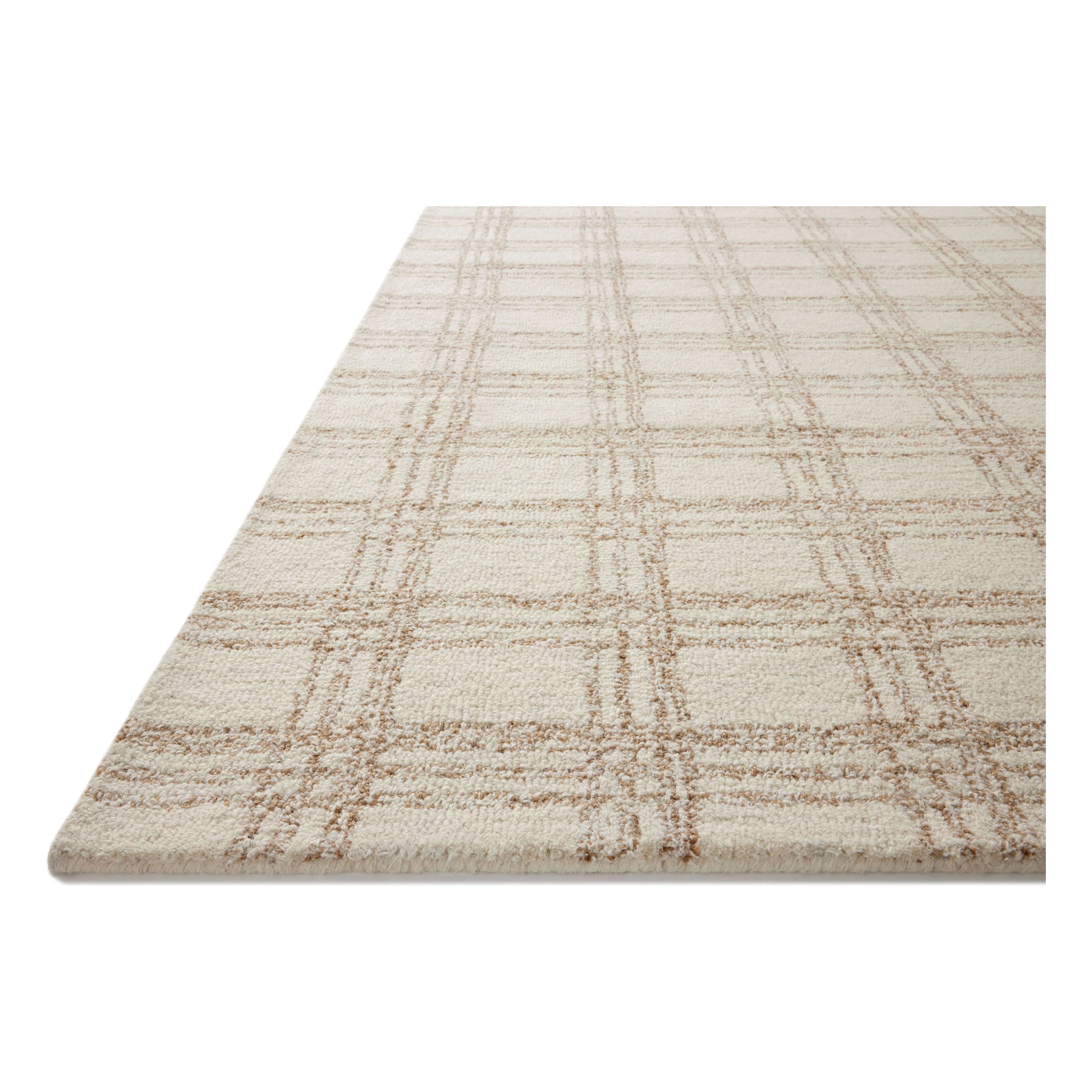 Featuring Chris Loves Julia x Loloi Polly Cream / Sand Rug by Loloi at Amethyst Home. Hand-tufted of wool and jute pile, the Polly collection for Chris Loves Julia x Loloi brings a fresh take on modern yet classic designs. With striking gridded designs toned down by a neutral color palette, Polly is a timeless choice for any room. Polly is also GoodWeave certif. Amethyst Home provides interior design, new home construction design consulting, vintage area rugs, and lighting in the Tampa metro area.