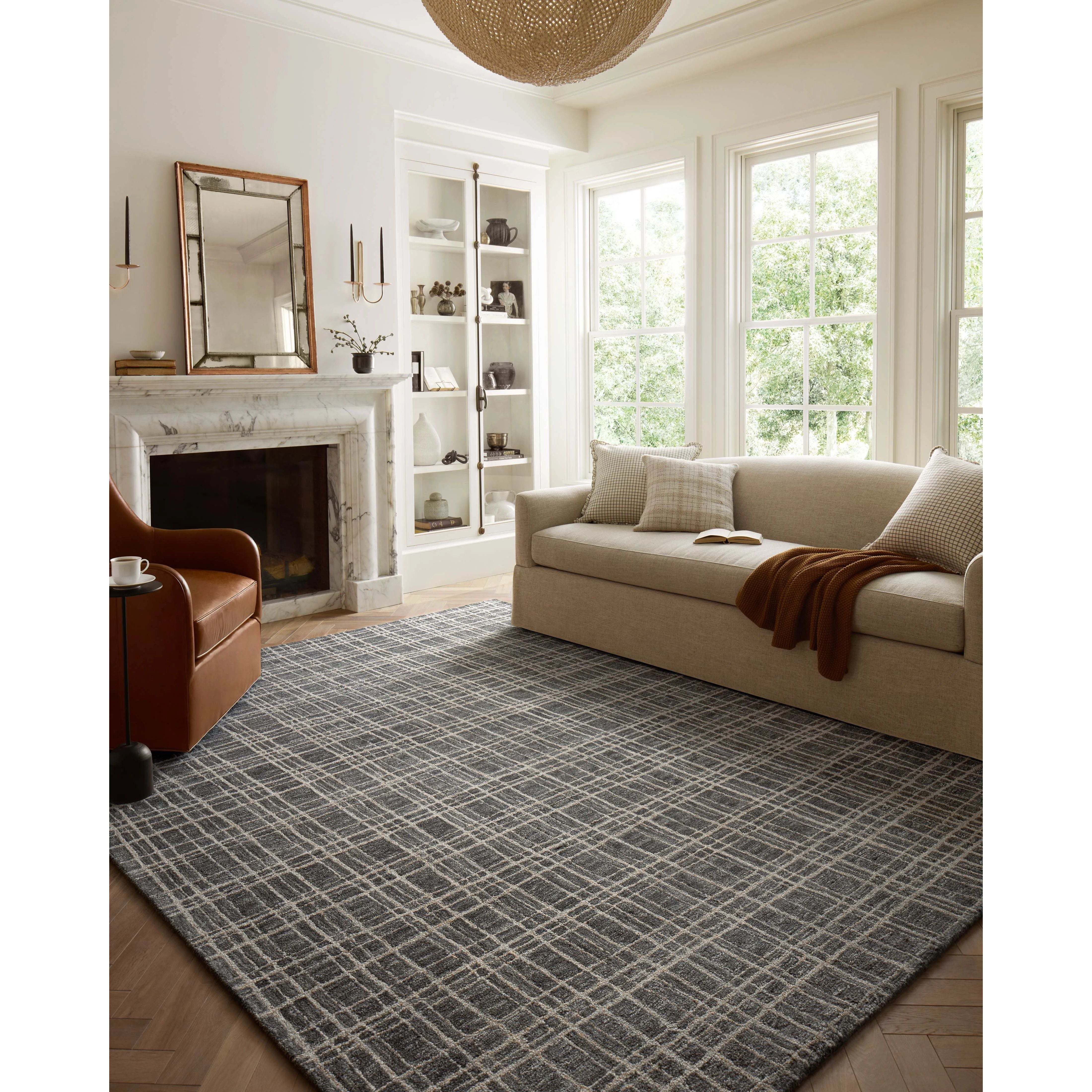Featuring Chris Loves Julia x Loloi Polly Graphite / Pebble Rug by Loloi at Amethyst Home. Hand-tufted of wool and jute pile, the Polly collection for Chris Loves Julia x Loloi brings a fresh take on modern yet classic designs. With striking gridded designs toned down by a neutral color palette, Polly is a timeless choice for any room. Polly is also GoodWeav. Amethyst Home provides interior design, new home construction design consulting, vintage area rugs, and lighting in the Monterey metro area.