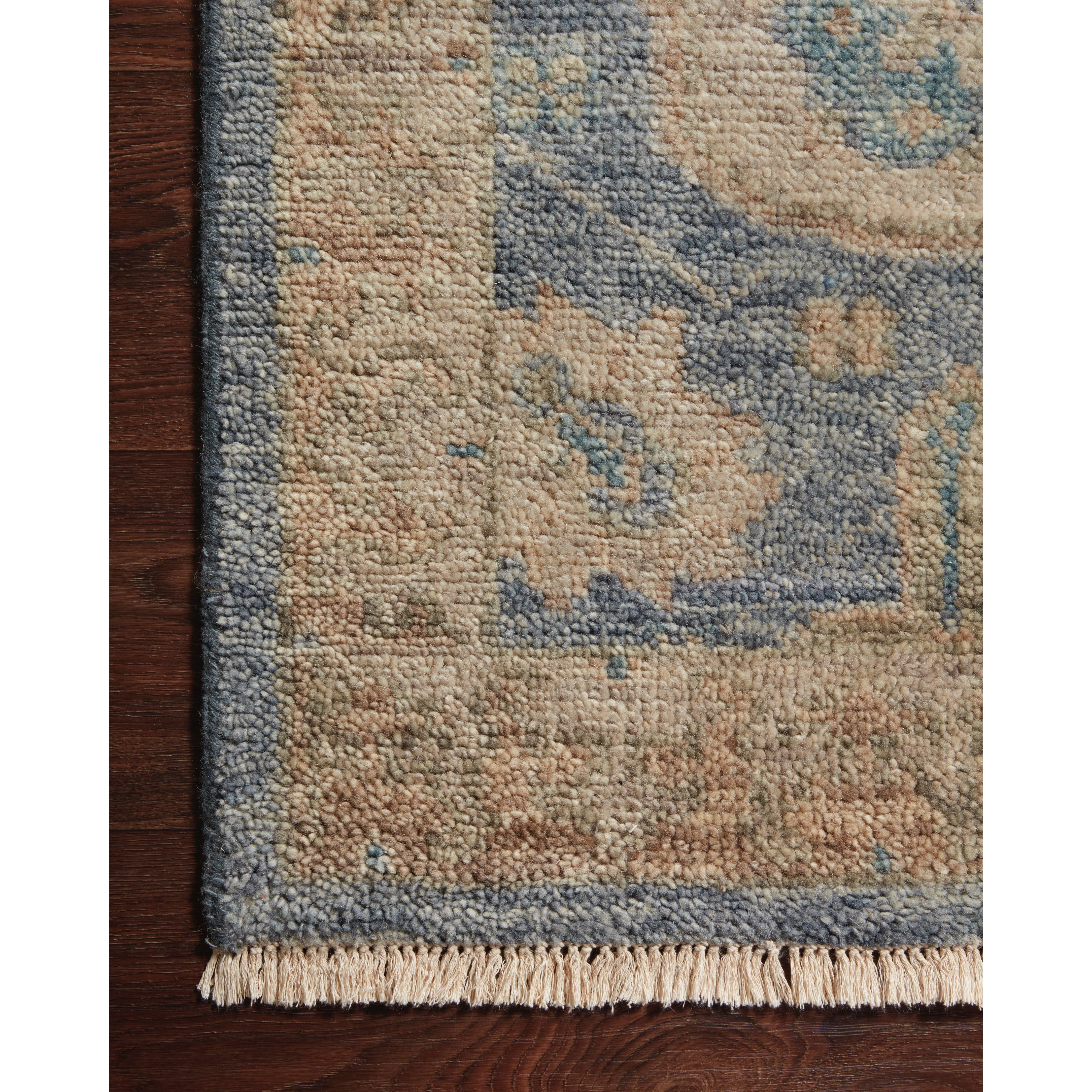 The Helena Indigo / Taupe HEL-06 rug from Loloi is hand-knotted of 100% wool, refined, yet versatile for any home. The Helena rug combines weathered tones and worldly patterns for a beautiful grounding element in any room. Amethyst Home provides interior design, new construction, custom furniture, and rugs for the Austin, Houston, and Dallas Texas metro area.