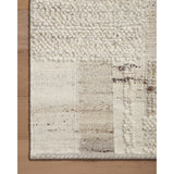Featuring Manfred Natural / Stone Hand-Knotted Rug by Loloi at Amethyst Home. Each area rug in the Manfred Natural / Stone rug collection is meticulously hand-knotted with a technique that creates a high-low texture, adding visual depth and movement. The rug’s patchwork design is casually sophisticated, fitting into living rooms, bedrooms, and dens—anywhere a t. Amethyst Home provides interior design, new home construction design consulting, vintage area rugs, and lighting in the Omaha metro area.