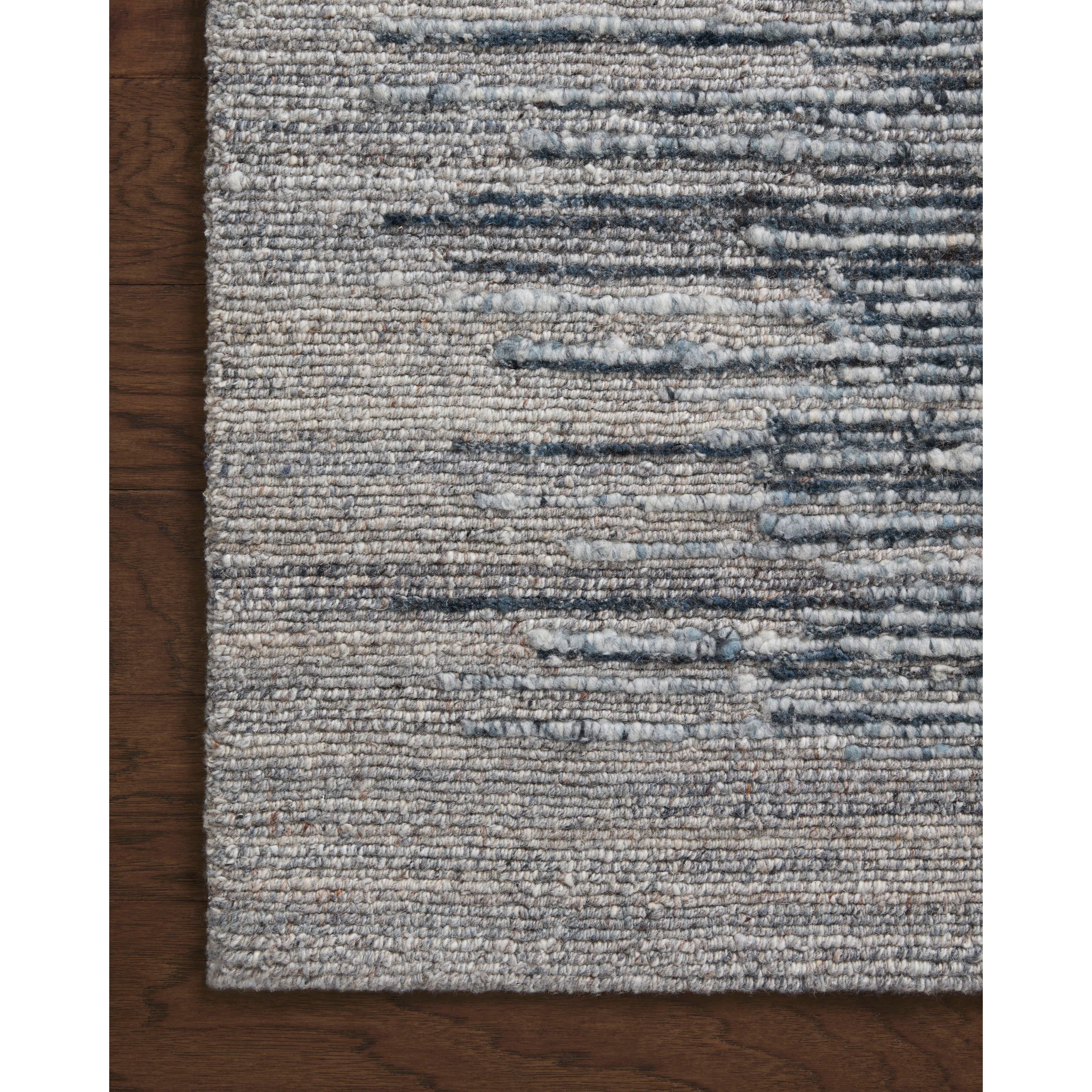 Featuring Raquel Denim / Grey Rug by Loloi at Amethyst Home. The Raquel Collection exemplifies what makes a hand-knotted rug so unique. Each area rug has a ribbed texture and subtle striping created by the artisan’s cut-and-loop technique. Raquel features an organic, asymmetrical linear pattern in an airy, neutral palette. With both an elevated look and fe. Amethyst Home provides interior design, new home construction design consulting, vintage area rugs, and lighting in the Alpharetta metro area.