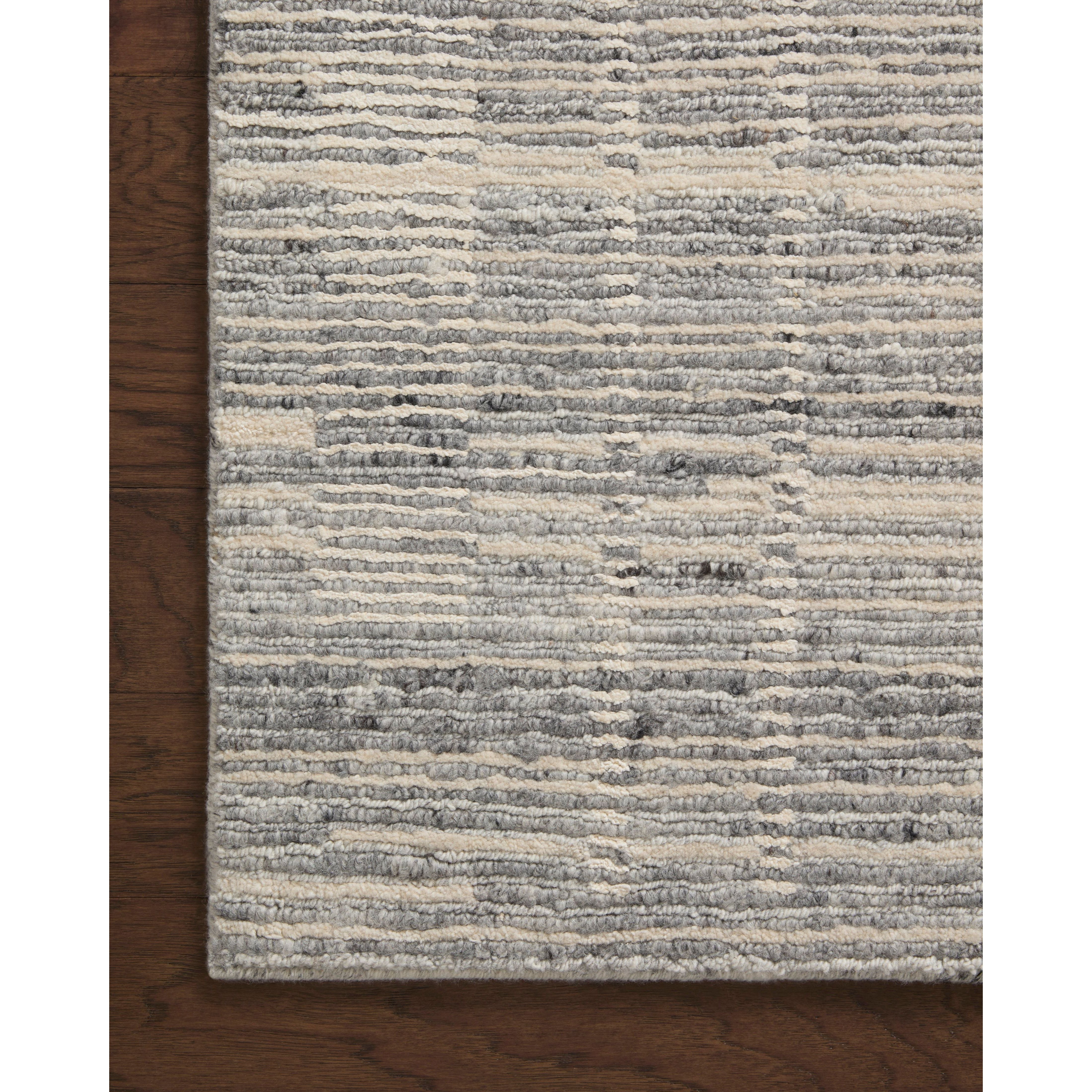 Featuring Raquel Grey / Ivory Rug by Loloi at Amethyst Home. The Raquel Collection exemplifies what makes a hand-knotted rug so unique. Each area rug has a ribbed texture and subtle striping created by the artisan’s cut-and-loop technique. Raquel features an organic, asymmetrical linear pattern in an airy, neutral palette. With both an elevated look and feel, t. Amethyst Home provides interior design, new home construction design consulting, vintage area rugs, and lighting in the Tampa metro area.