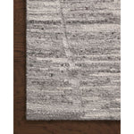 Featuring Raquel Grey / Stone Rug by Loloi at Amethyst Home. The Raquel Collection exemplifies what makes a hand-knotted rug so unique. Each area rug has a ribbed texture and subtle striping created by the artisan’s cut-and-loop technique. Raquel features an organic, asymmetrical linear pattern in an airy, neutral palette. With both an elevated look and feel, . Amethyst Home provides interior design, new home construction design consulting, vintage area rugs, and lighting in the Austin metro area.