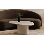 The Eden coffee table features a rounded triangular shape and oval pedestal base, creating a scultural silhouette that exudes modern sophistication. An ivory white and black high gloss finishes this coffee table's surface, reflecting light, brightening and opening up any space Amethyst Home provides interior design, new home construction design consulting, vintage area rugs, and lighting in the Winter Garden metro area.