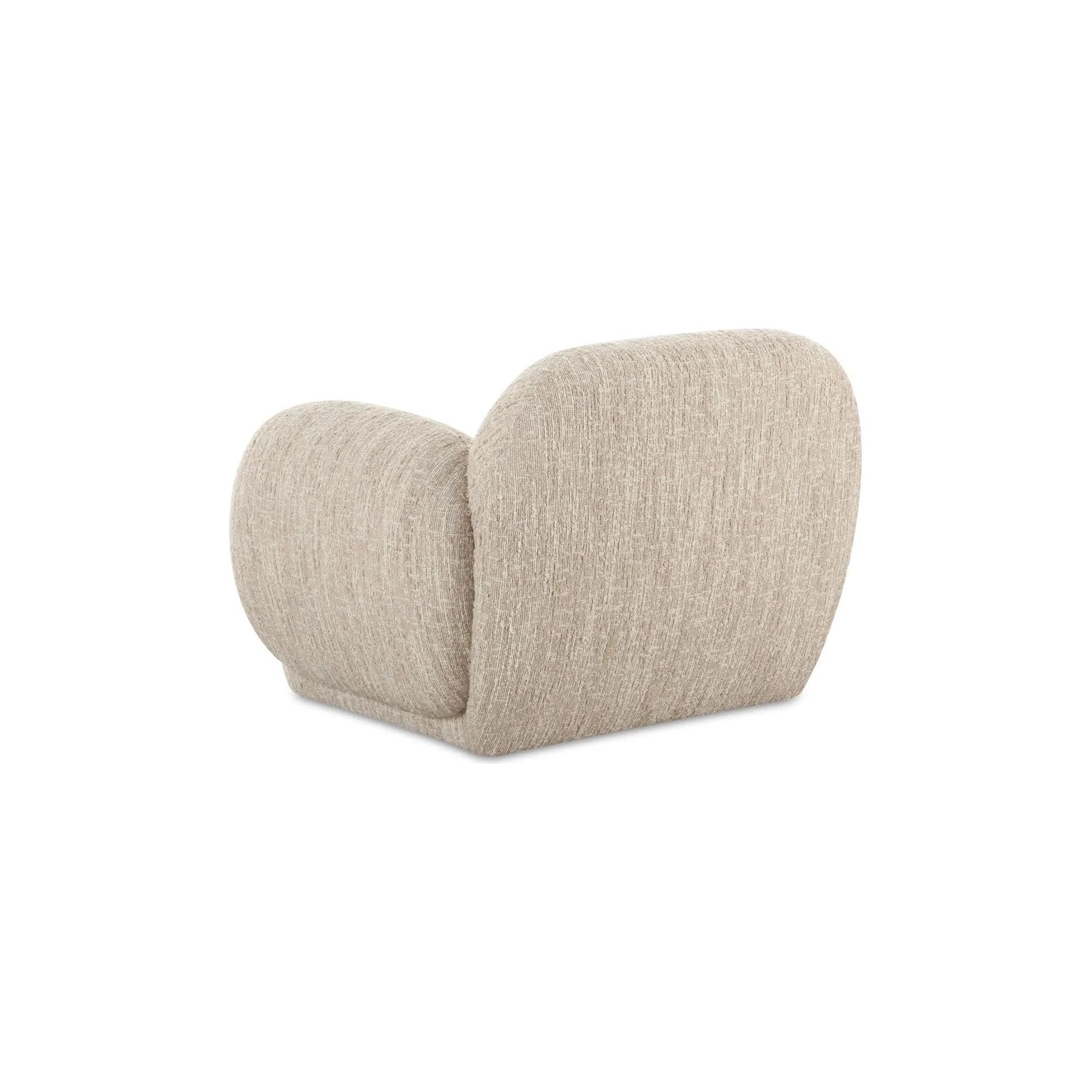 The Hazel lounge chair embraces minimalist, understated elegance with its low-profile, modernist silhouette. Wrapped in exaggerated boucle fabric, it offers a distinct tactility and comfort. The bold, curved arm design makes a stylish statement, harmonizing with the sleek form to create an inviting focal point in any setting Amethyst Home provides interior design, new home construction design consulting, vintage area rugs, and lighting in the Des Moines metro area.