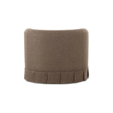 The Maren swivel chair exudes a soft, feminine aesthetic, upholstered in a warm, neutral fabric and featuring a playful yet refined box pleat base reminiscent of vintage finesse, straddling the line between contemporary form and traditional finish. Amethyst Home provides interior design, new home construction design consulting, vintage area rugs, and lighting in the Winter Garden metro area.