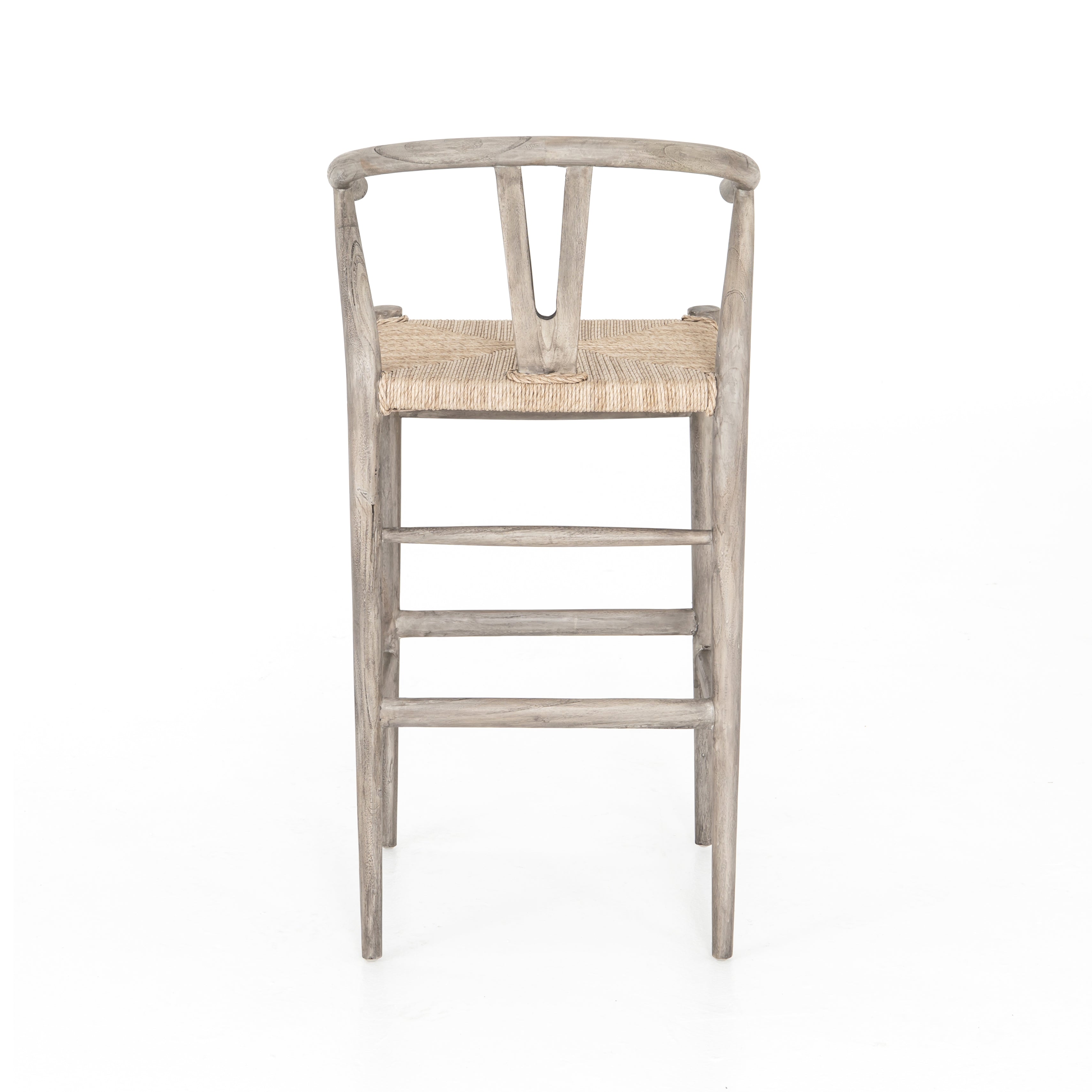 Featuring Muestra Counter + Bar Stool - Weathered Grey by Four Hands at Amethyst Home. Modern curves redefine the classic wishbone-style counter stool. Vintage white all-weather wicker is woven for a dose of fresh texture within weathered grey teak framing. Cover or store indoors during inclement weather and when not in use.
Counter Stool Overall Size: 21.. Amethyst Home provides interior design, new home construction design consulting, vintage area rugs, and lighting in the Alpharetta metro area.