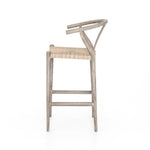 Featuring Muestra Counter + Bar Stool - Weathered Grey by Four Hands at Amethyst Home. Modern curves redefine the classic wishbone-style counter stool. Vintage white all-weather wicker is woven for a dose of fresh texture within weathered grey teak framing. Cover or store indoors during inclement weather and when not in use.
Counter Stool Overall Size: 21.5. Amethyst Home provides interior design, new home construction design consulting, vintage area rugs, and lighting in the Nashville metro area.