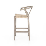 Featuring Muestra Counter + Bar Stool - Weathered Grey by Four Hands at Amethyst Home. Modern curves redefine the classic wishbone-style counter stool. Vintage white all-weather wicker is woven for a dose of fresh texture within weathered grey teak framing. Cover or store indoors during inclement weather and when not in use.
Counter Stool Overall Size: 21.5. Amethyst Home provides interior design, new home construction design consulting, vintage area rugs, and lighting in the Nashville metro area.